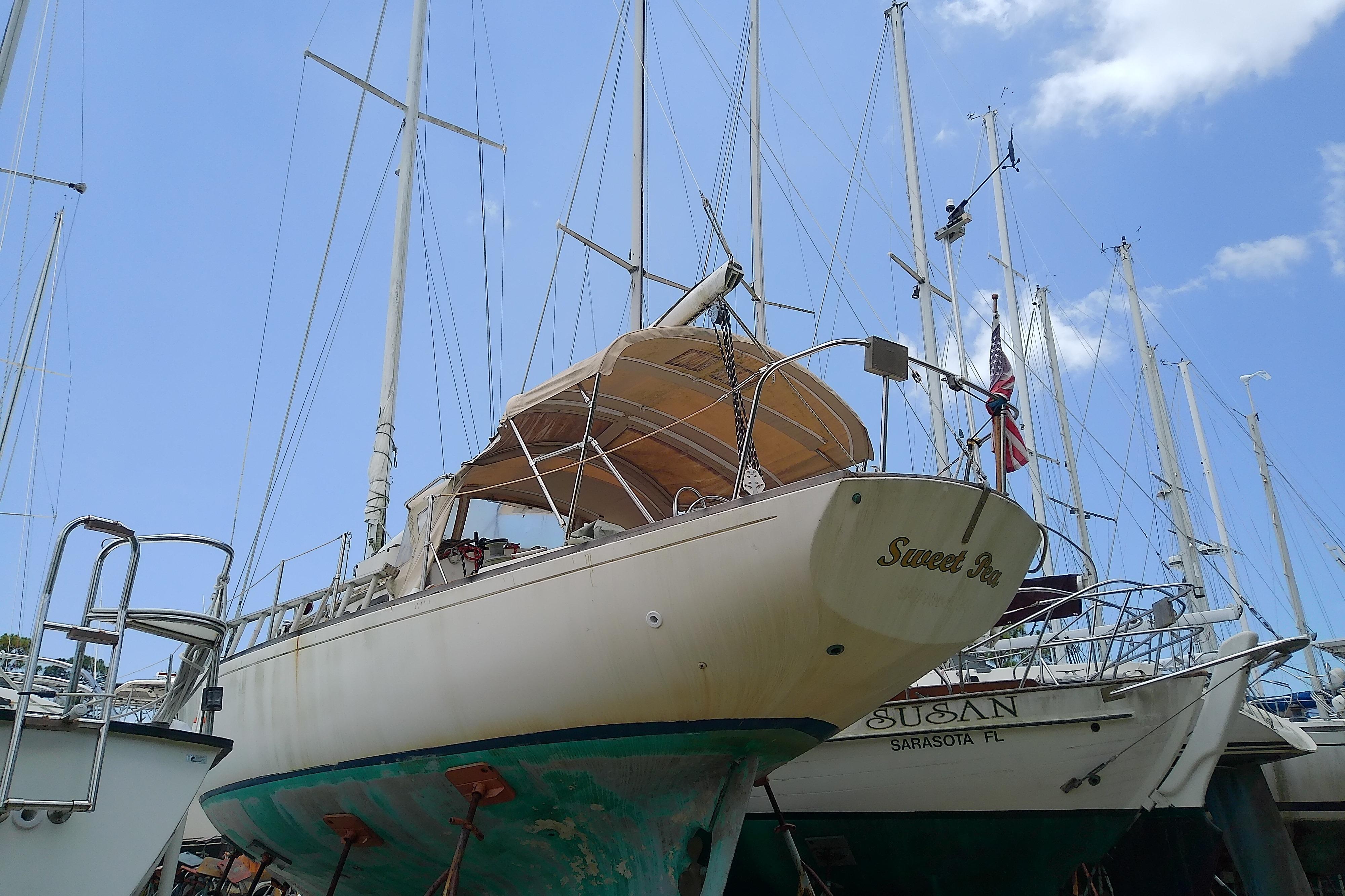 1981 Sea Sprite 34 sailboat on dry dock, with clear blue sky background.