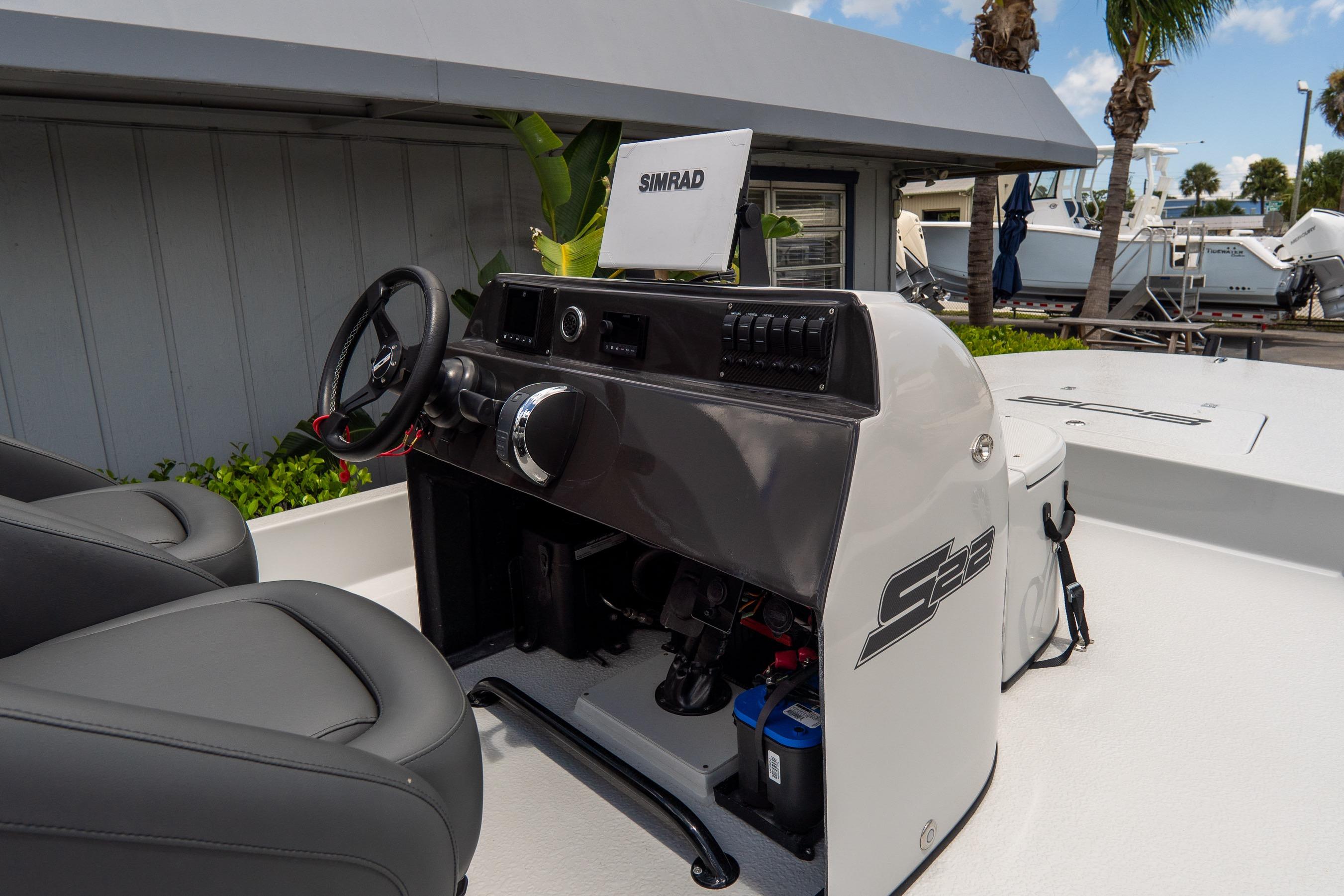 2021 SCB S22 boat console with Simrad display and dual seats.