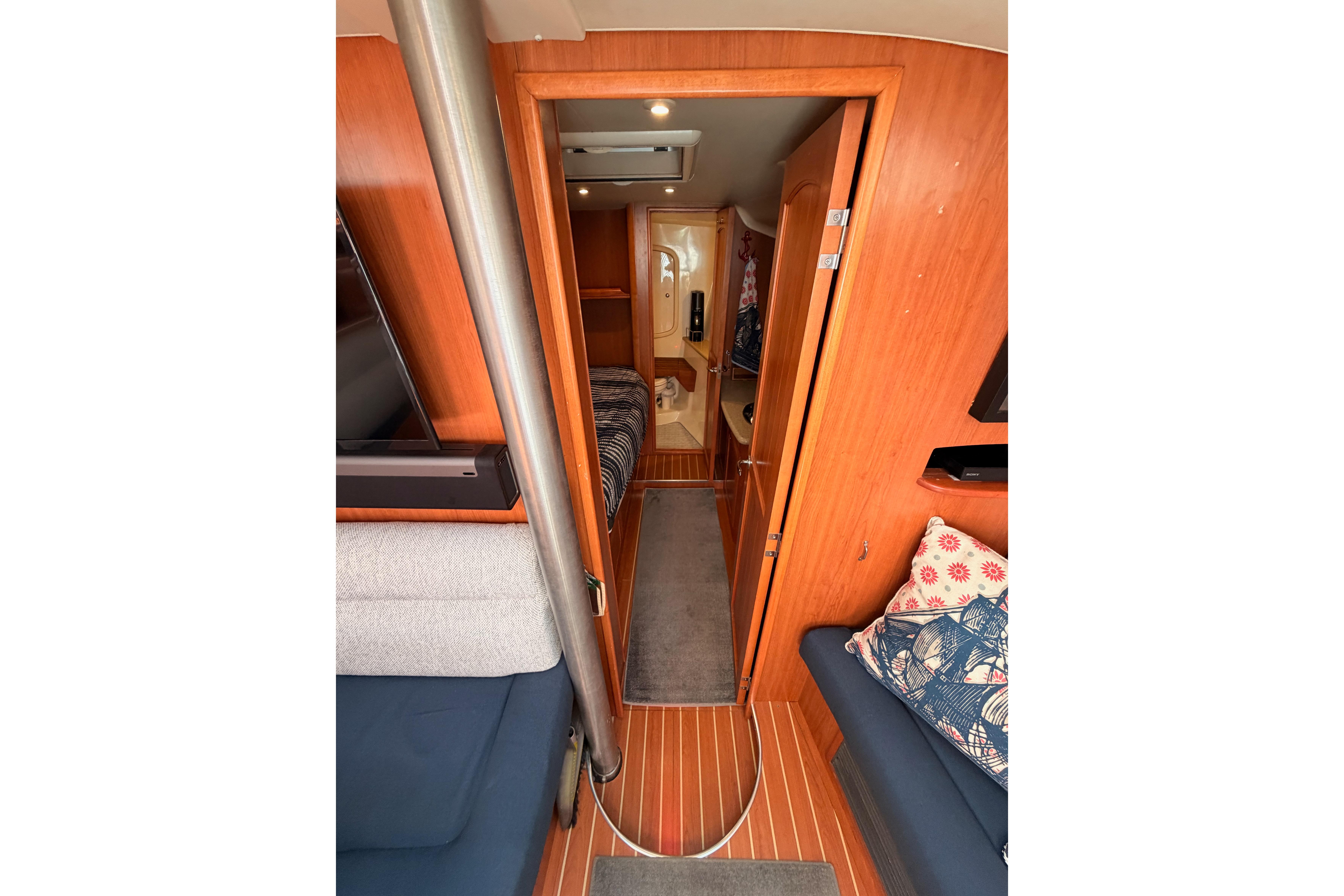 Interior of 2008 Hunter 45 Deck Salon, featuring cozy seating and wooden finishes.
