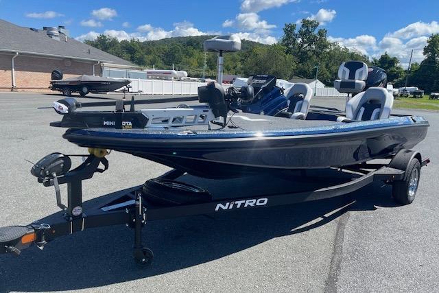 Nitro Z18 Pro 2026 fishing boat on trailer, parked outdoors under a clear sky.
