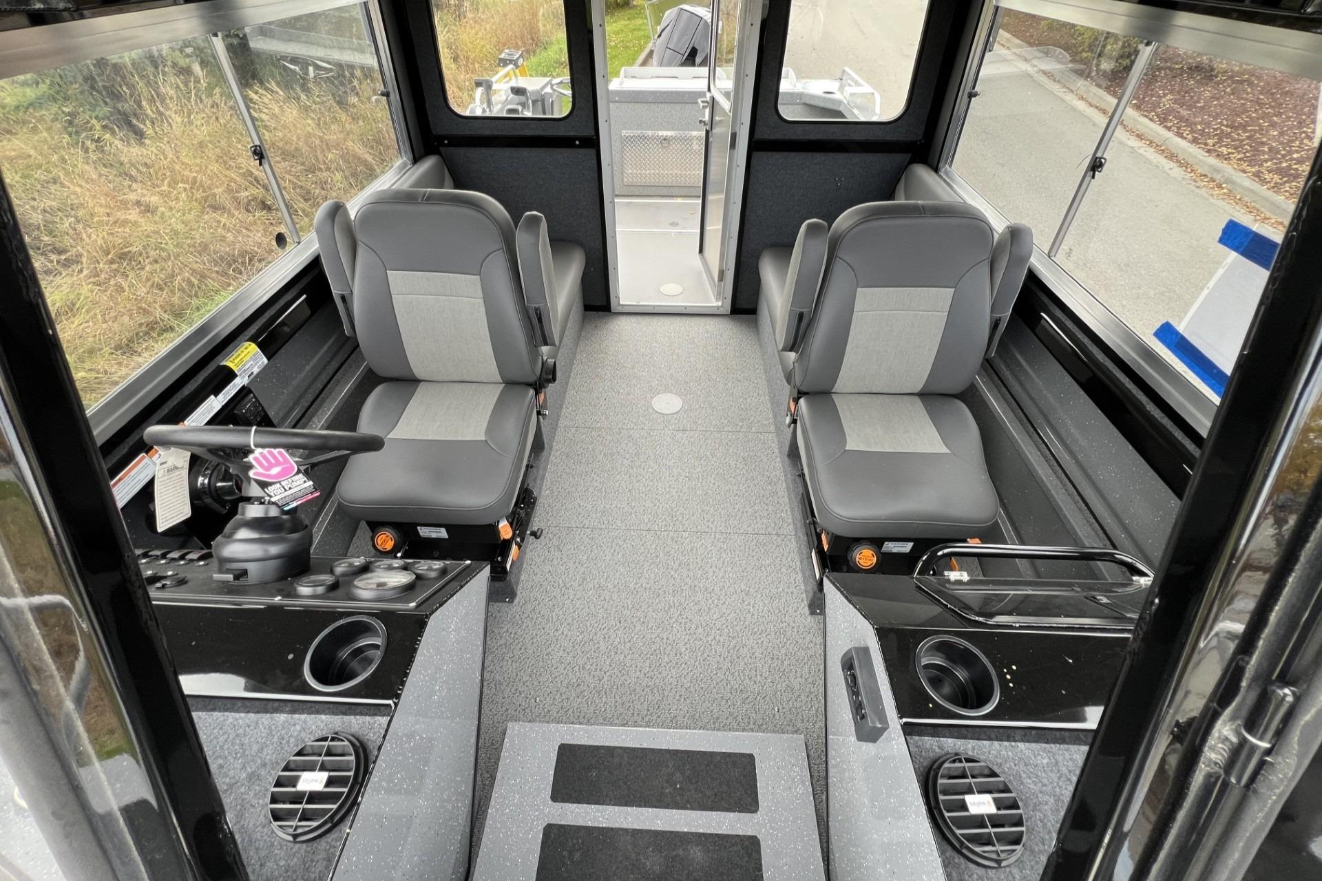 2024 Spartan 220 Maximus boat interior with dual seats and modern controls.