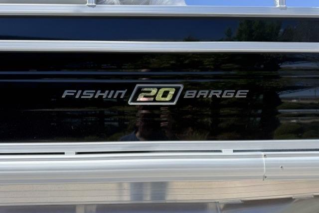2026 Sun Tracker Fishin' Barge 20 DLX logo on sleek black panel.