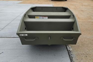 2026 Tracker Grizzly 10 Jon boat on concrete surface, showcasing sturdy design and spacious interior.