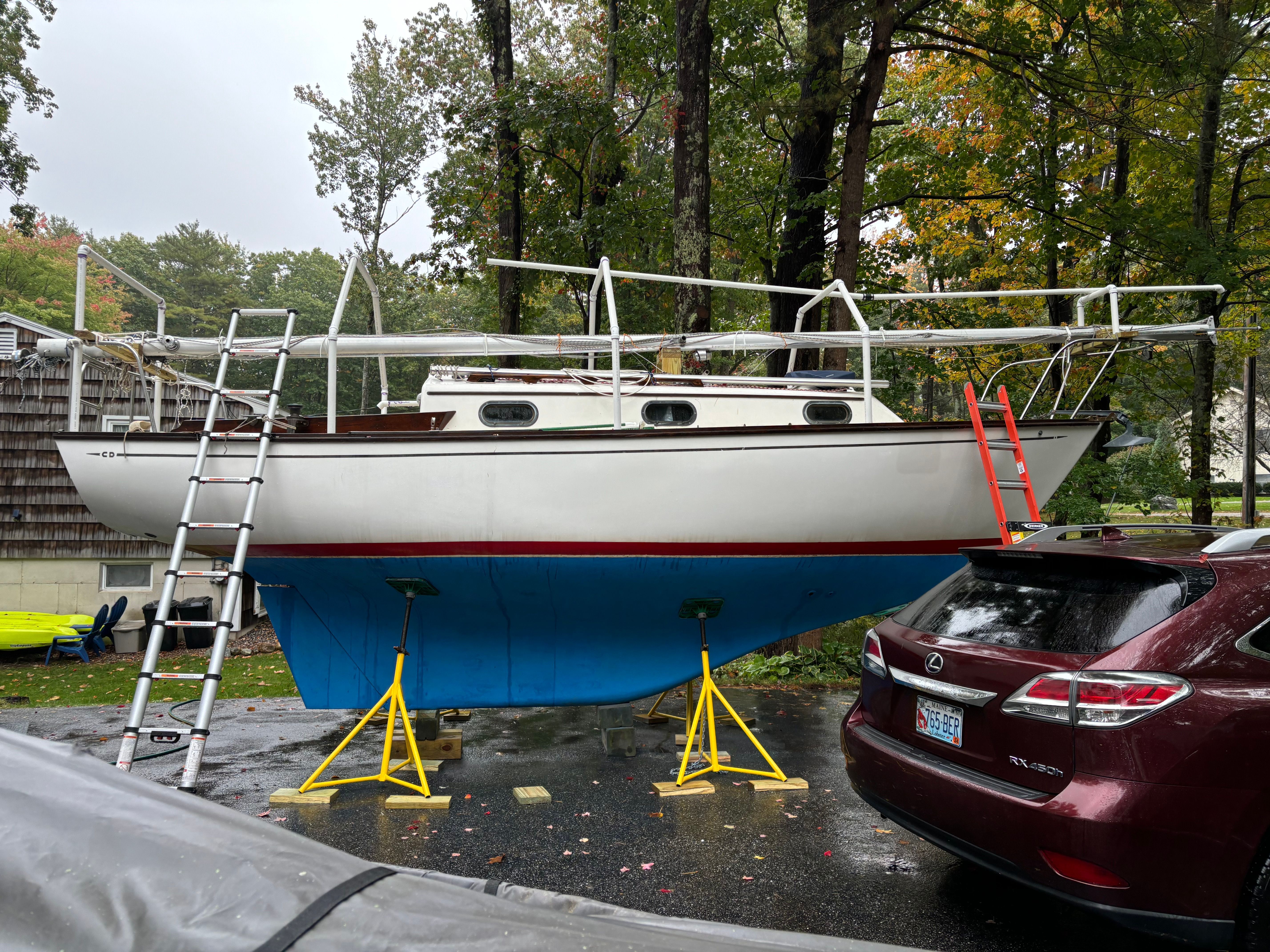 1986 Cape Dory 26 sailboat on stands outdoors.
