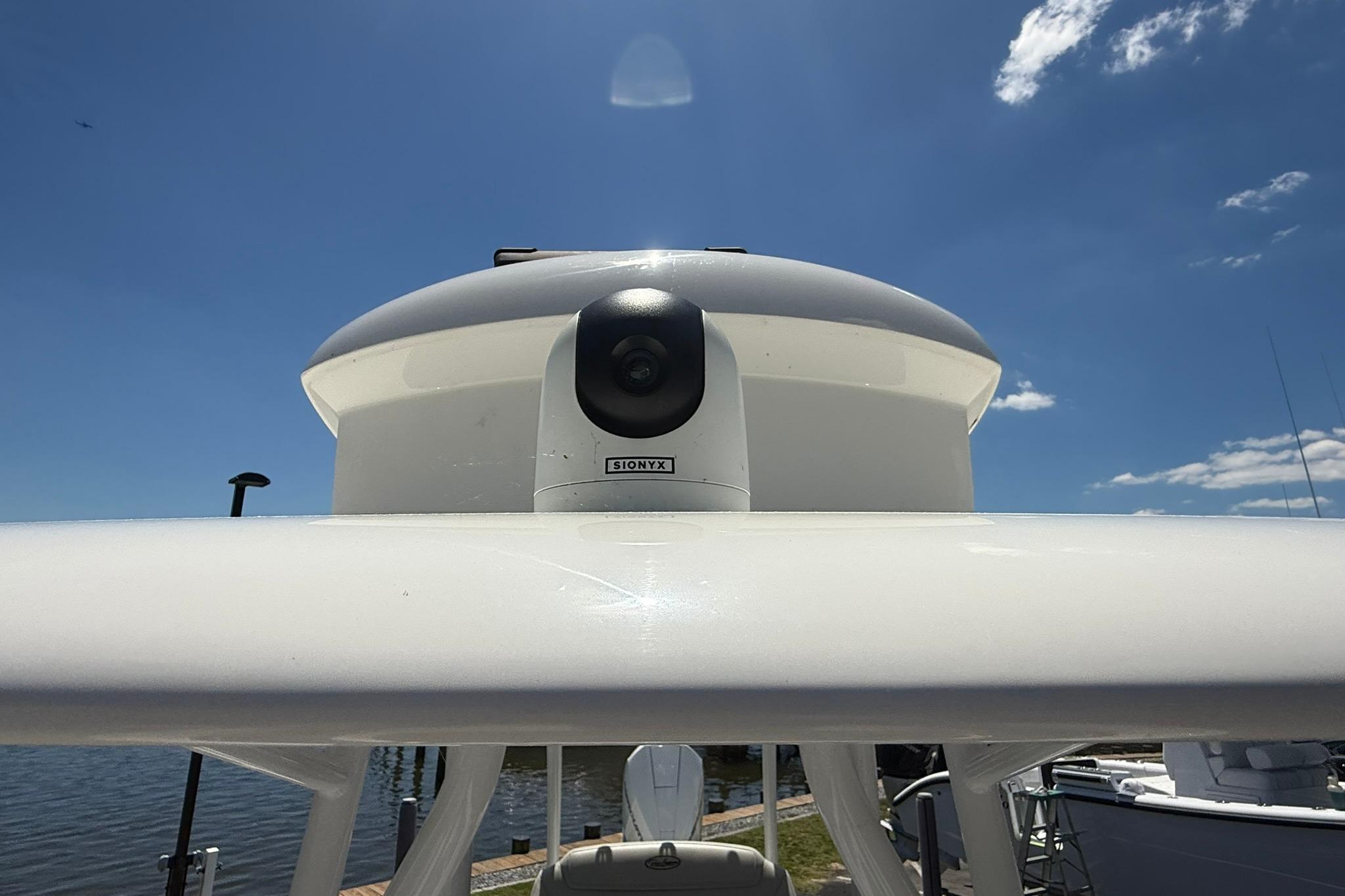 2024 Pair Customs 24 Center Console MV with mounted camera under clear blue sky.