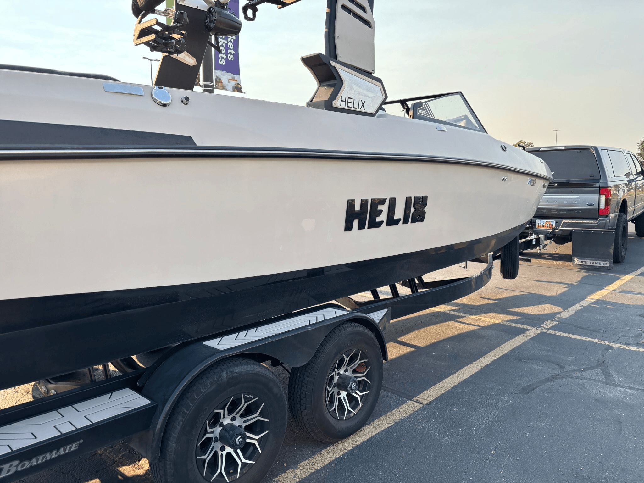 Custom DSB25 boat from 2025 on trailer in parking lot.
