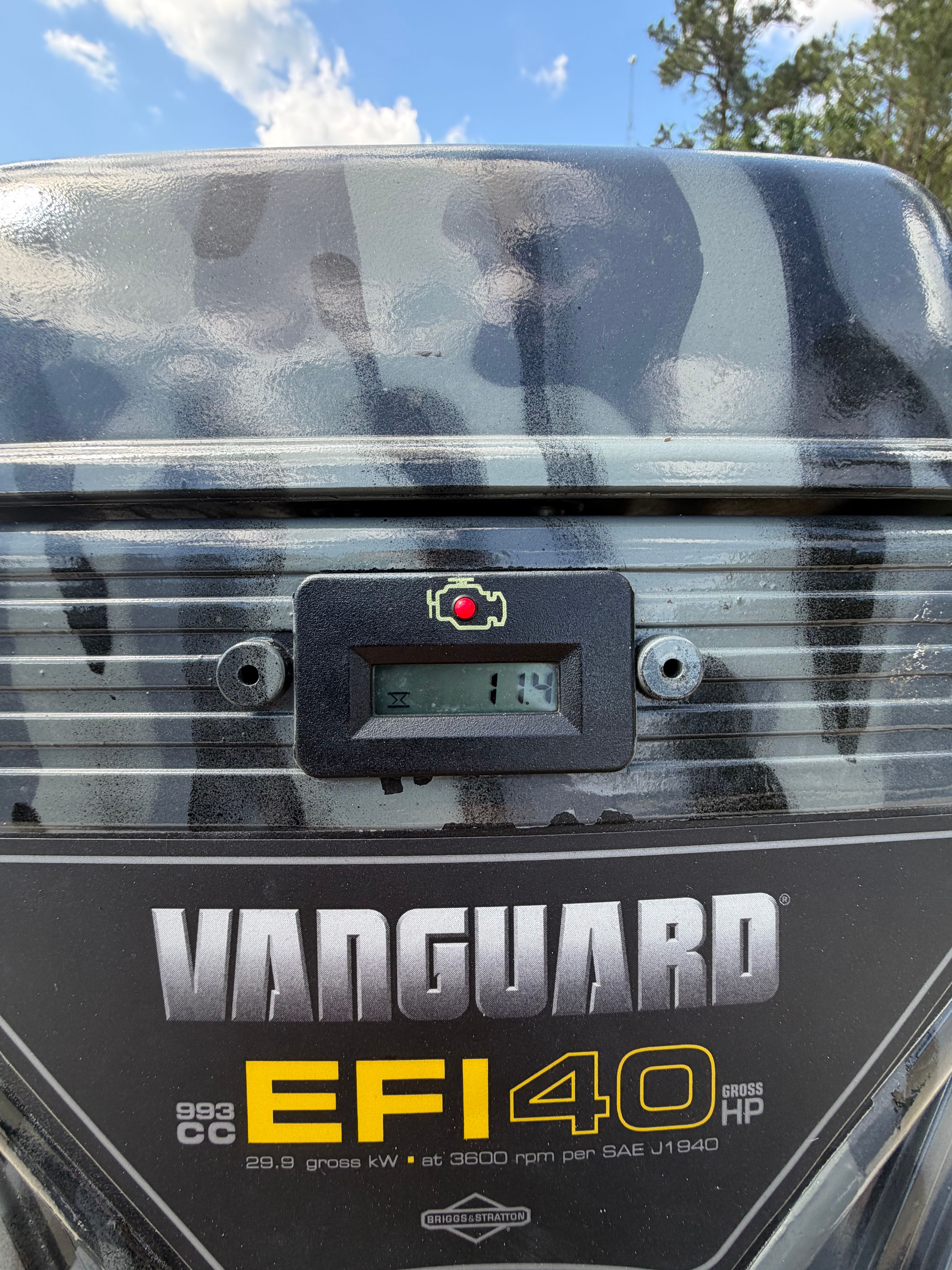 Close-up of a Vanguard EFI 40 engine cover display with digital readout.