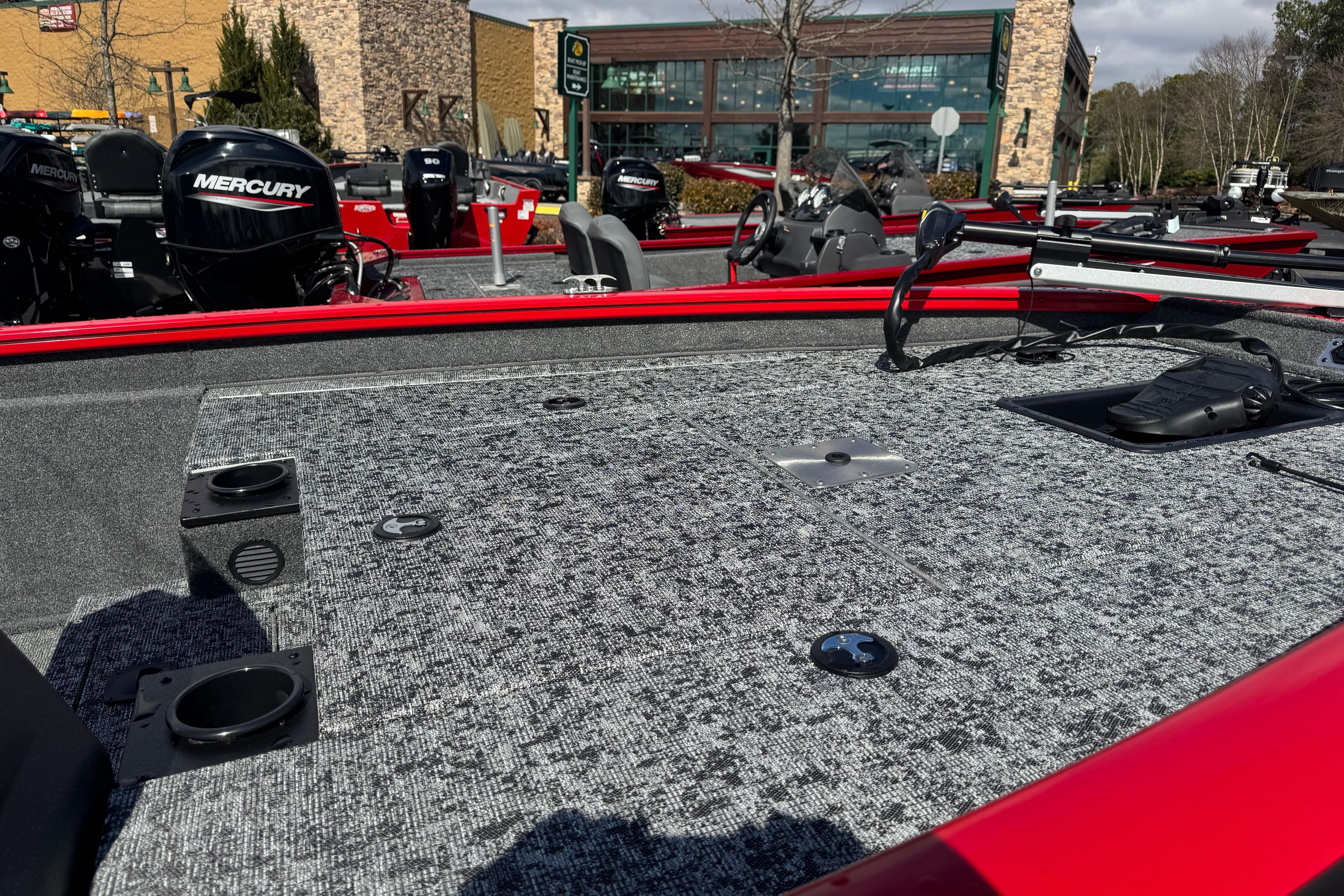 2026 Tracker Pro Team 175 boat deck with Mercury engine, outdoor display.