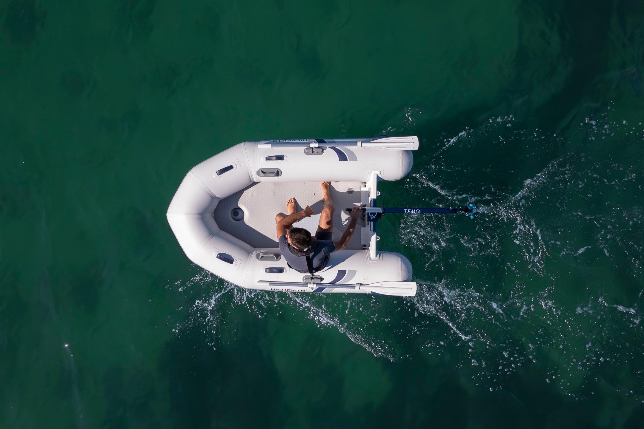 Aerial view of Highfield Roll-Up 250 KAM boat on water.