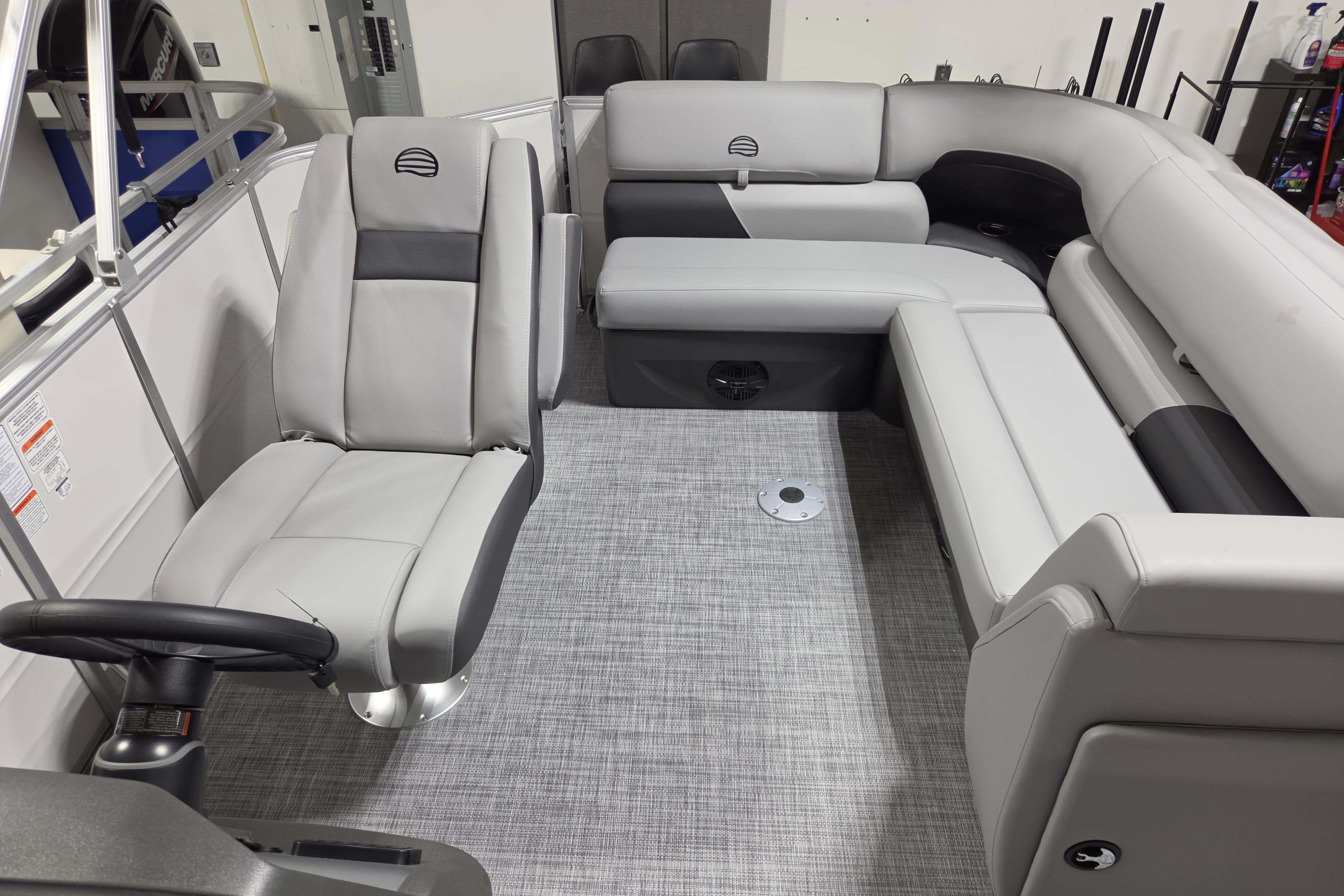 2026 Sun Tracker Party Barge 20 DLX interior with gray seating and modern design.