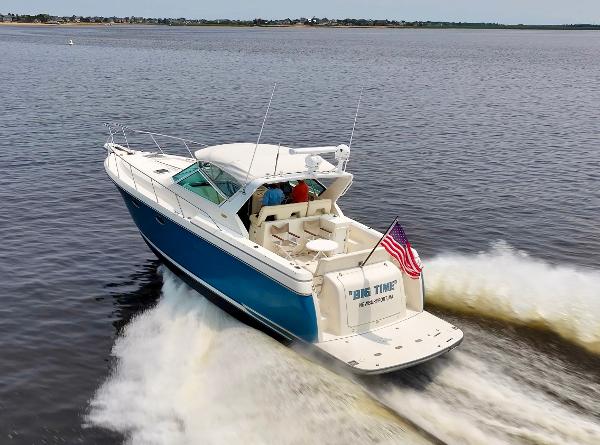 1996 Tiara Yachts 3500 Express cruising with American flag waving.