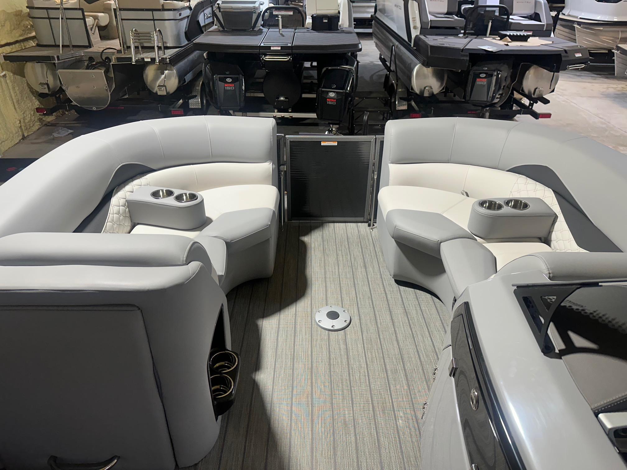 2022 Manitou 23 Encore SL pontoon boat interior with gray seating and cup holders.