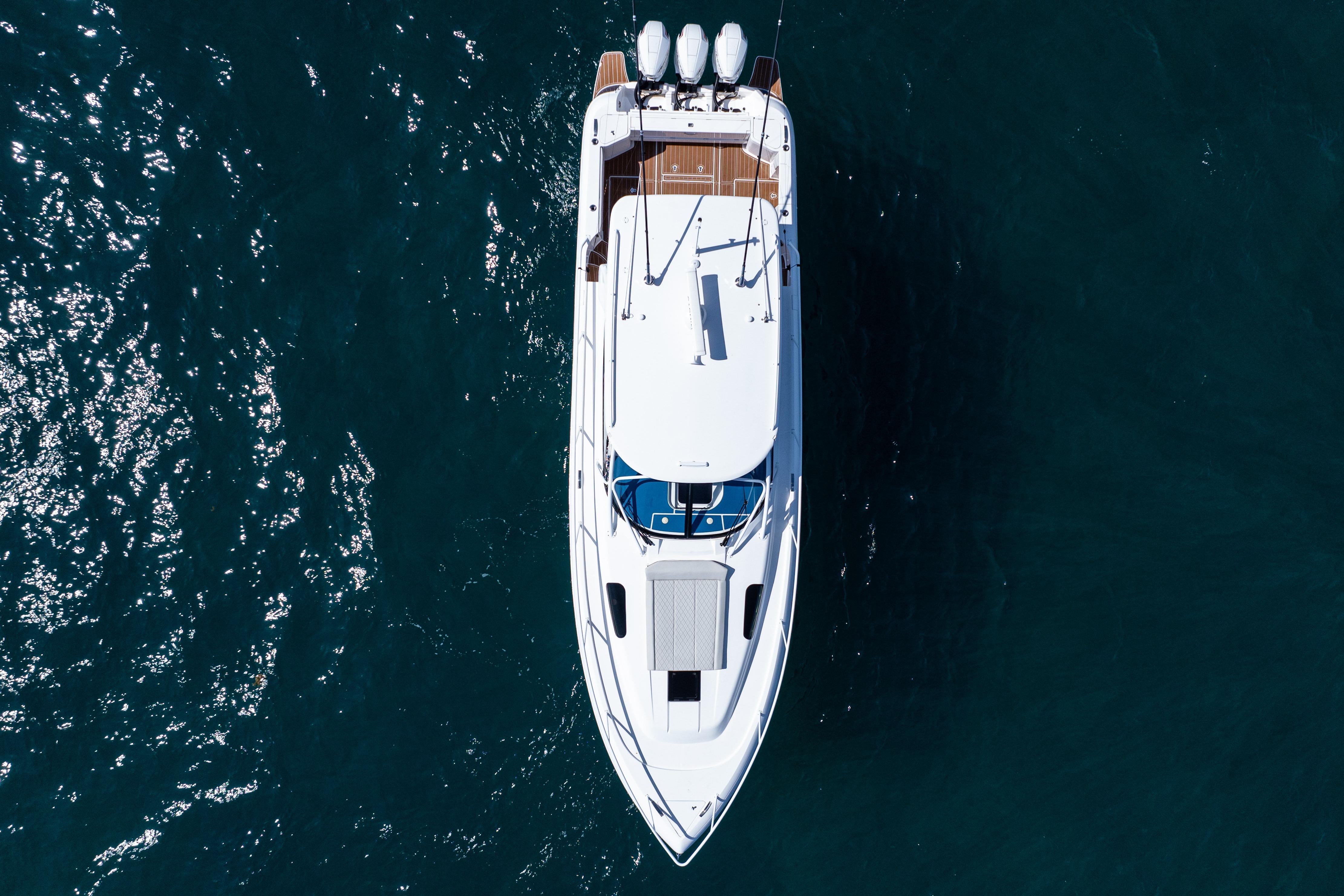 Overhead view of 2018 Intrepid 438 Evolution yacht on deep blue water.