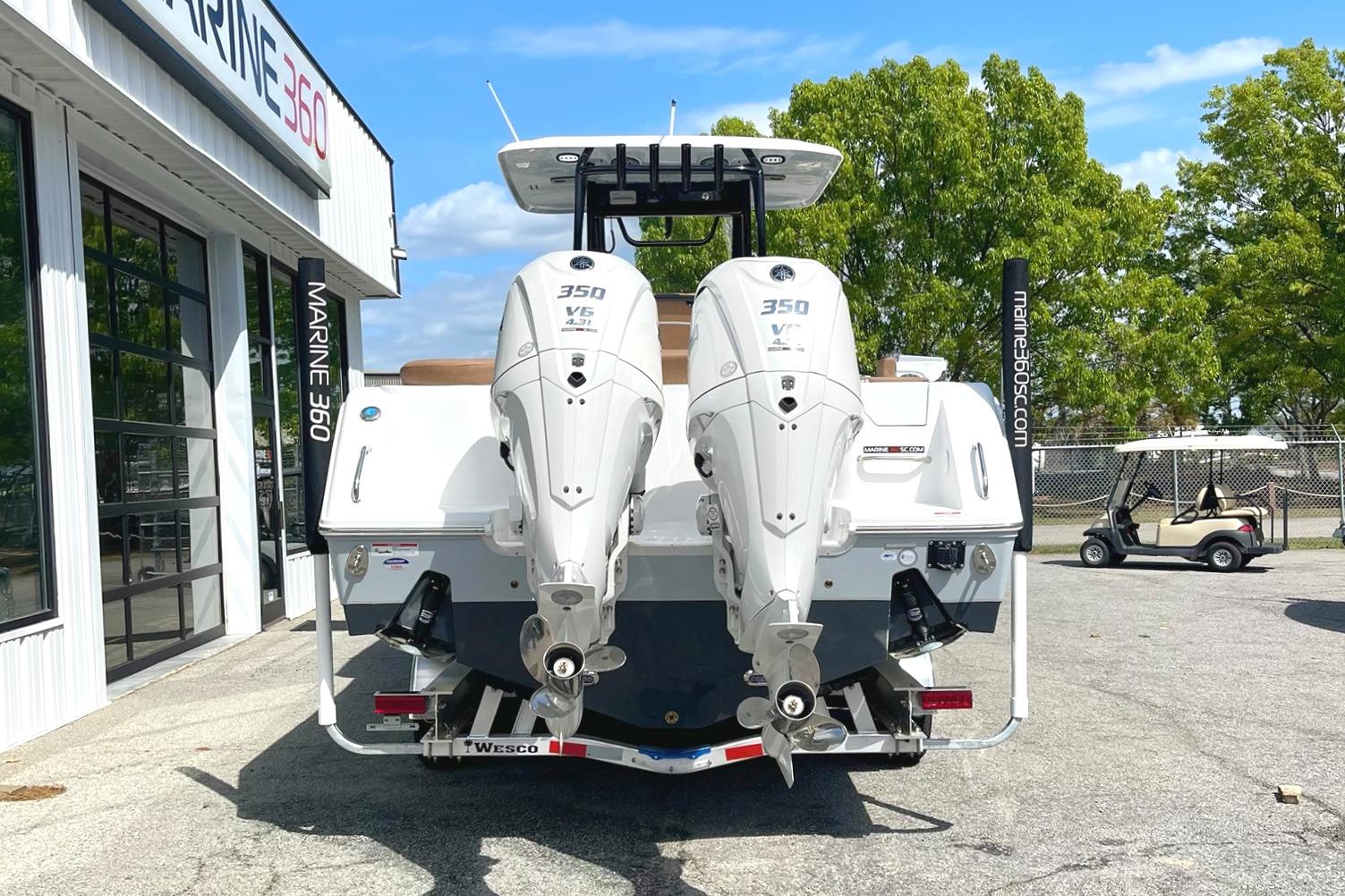 2026 Seahunt Ultra 305 CB boat with twin 350 V6 engines at Marine 360 dealership.