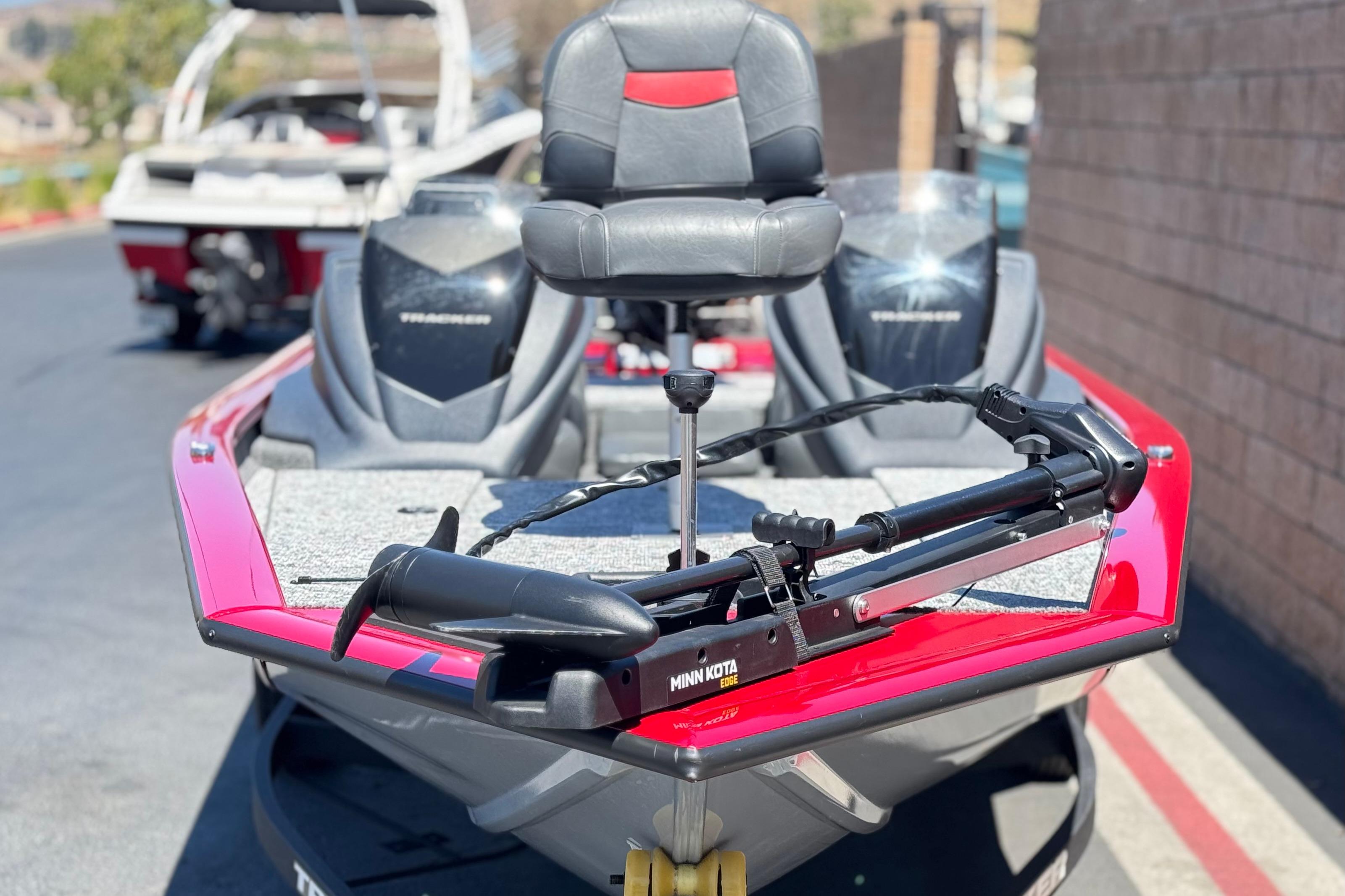 2025 Tracker Pro Team 175 TXW boat with Minn Kota trolling motor, red and gray design.