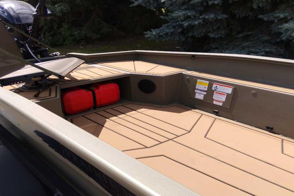 2026 Tracker Grizzly 1650 T Prairie Wings Edition boat interior with storage and seating.