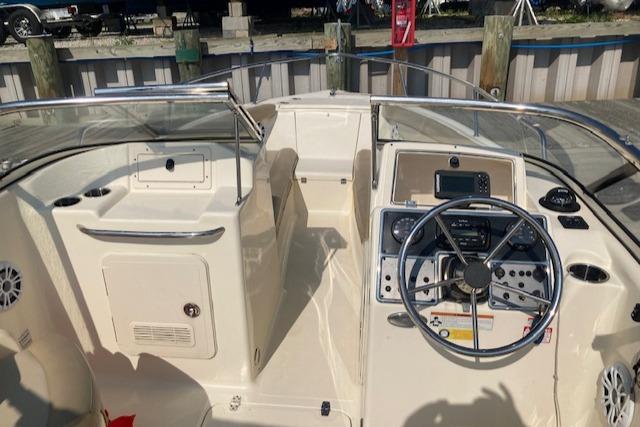 2023 Scout 210 Dorado boat interior with steering wheel and control panel.