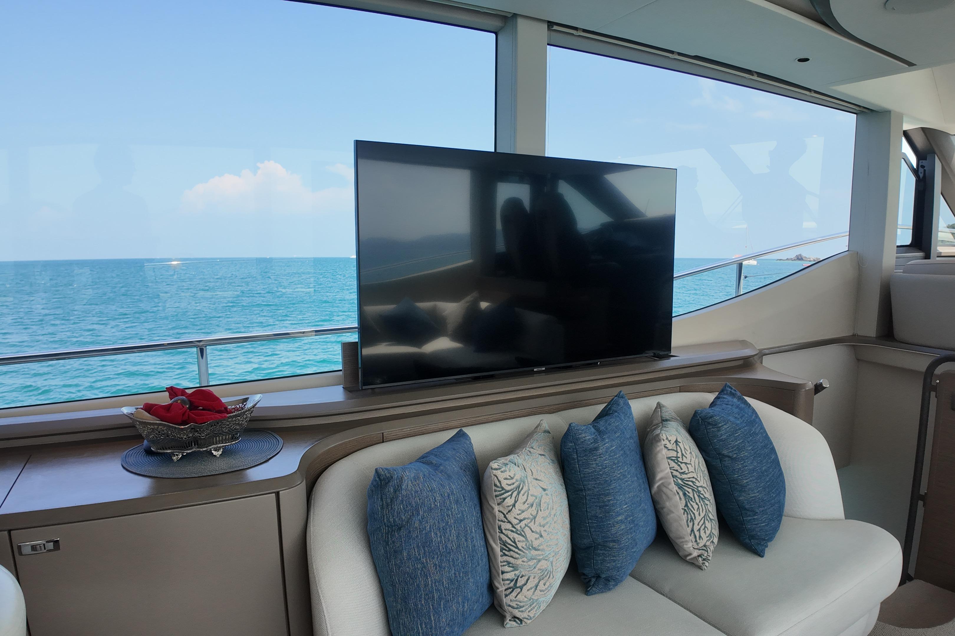 Luxurious interior of 2023 Princess Y72 yacht with ocean view and plush seating.