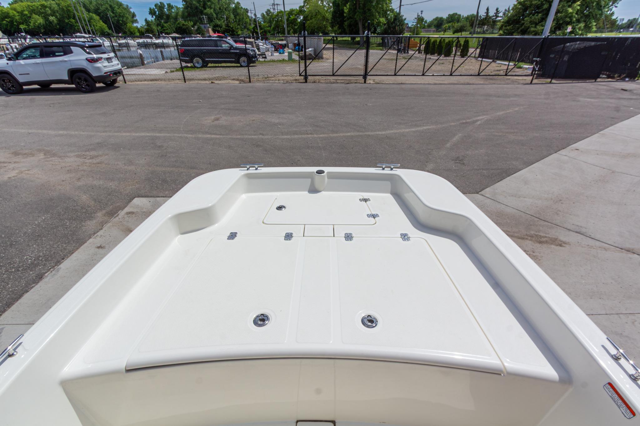 2020 Mako Pro Skiff 15 CC boat deck in a parking lot setting.