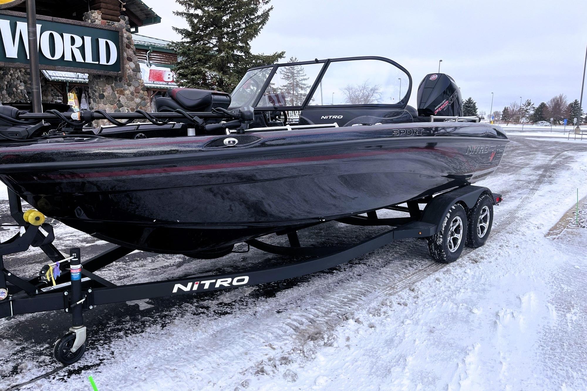2026 Nitro ZV19 Sport Pro boat on a snowy trailer, parked outdoors.