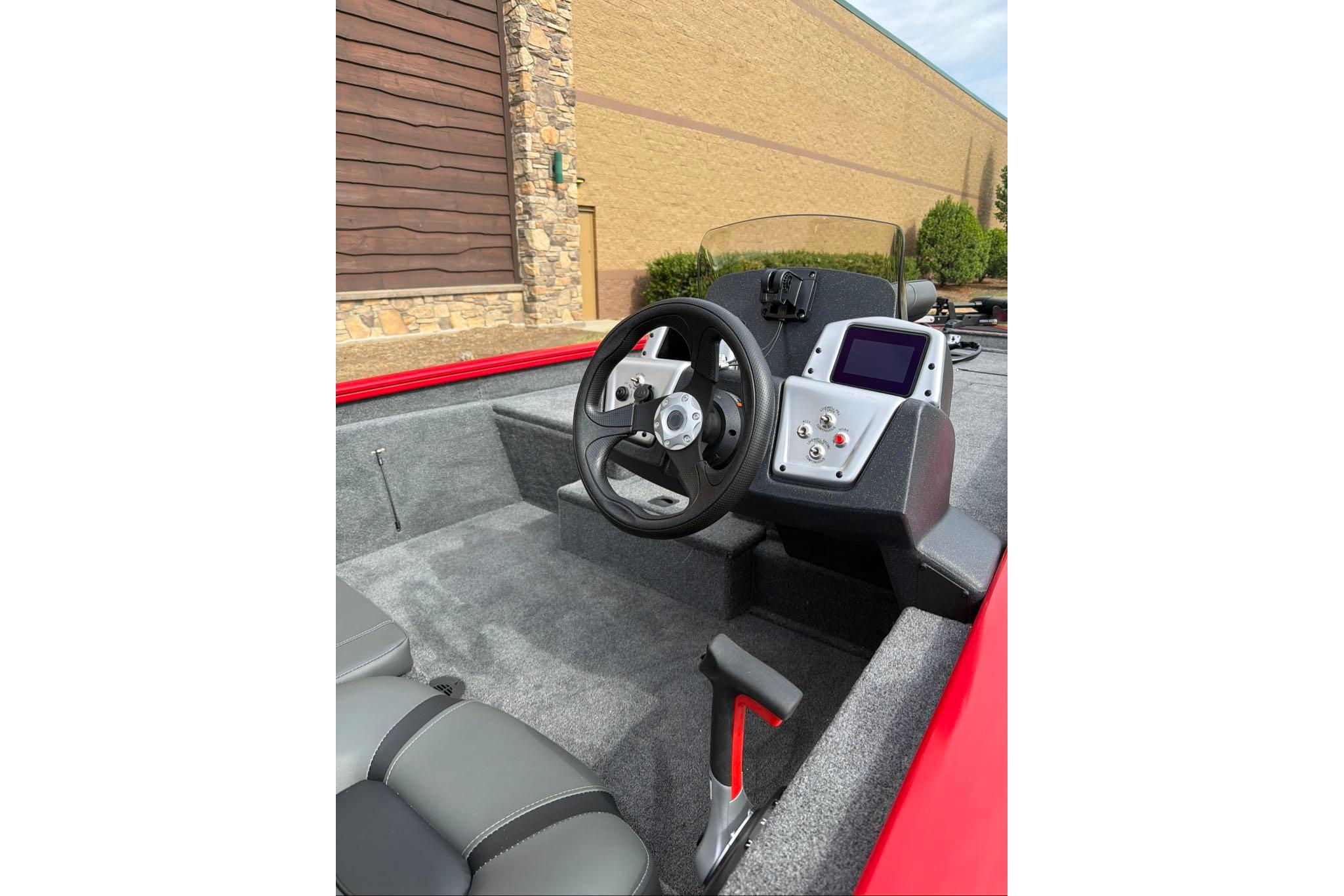 2026 Tracker Pro Team 190 boat interior with steering wheel and control panel.