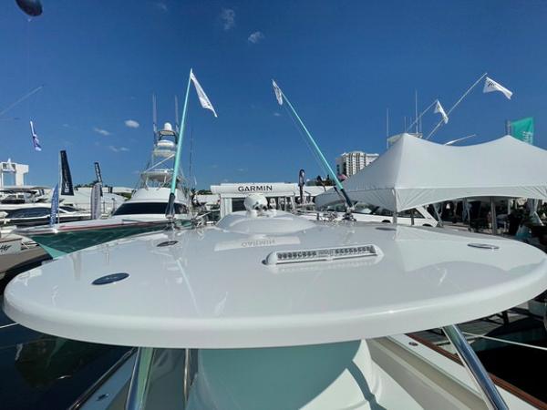 2025 Mag Bay 43 Center Console boat at a marina, showcasing sleek design.