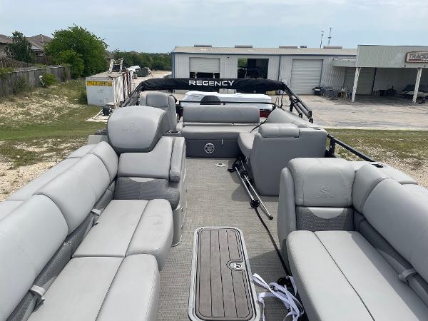 2023 Regency 250DL3 pontoon boat with spacious seating and modern design.