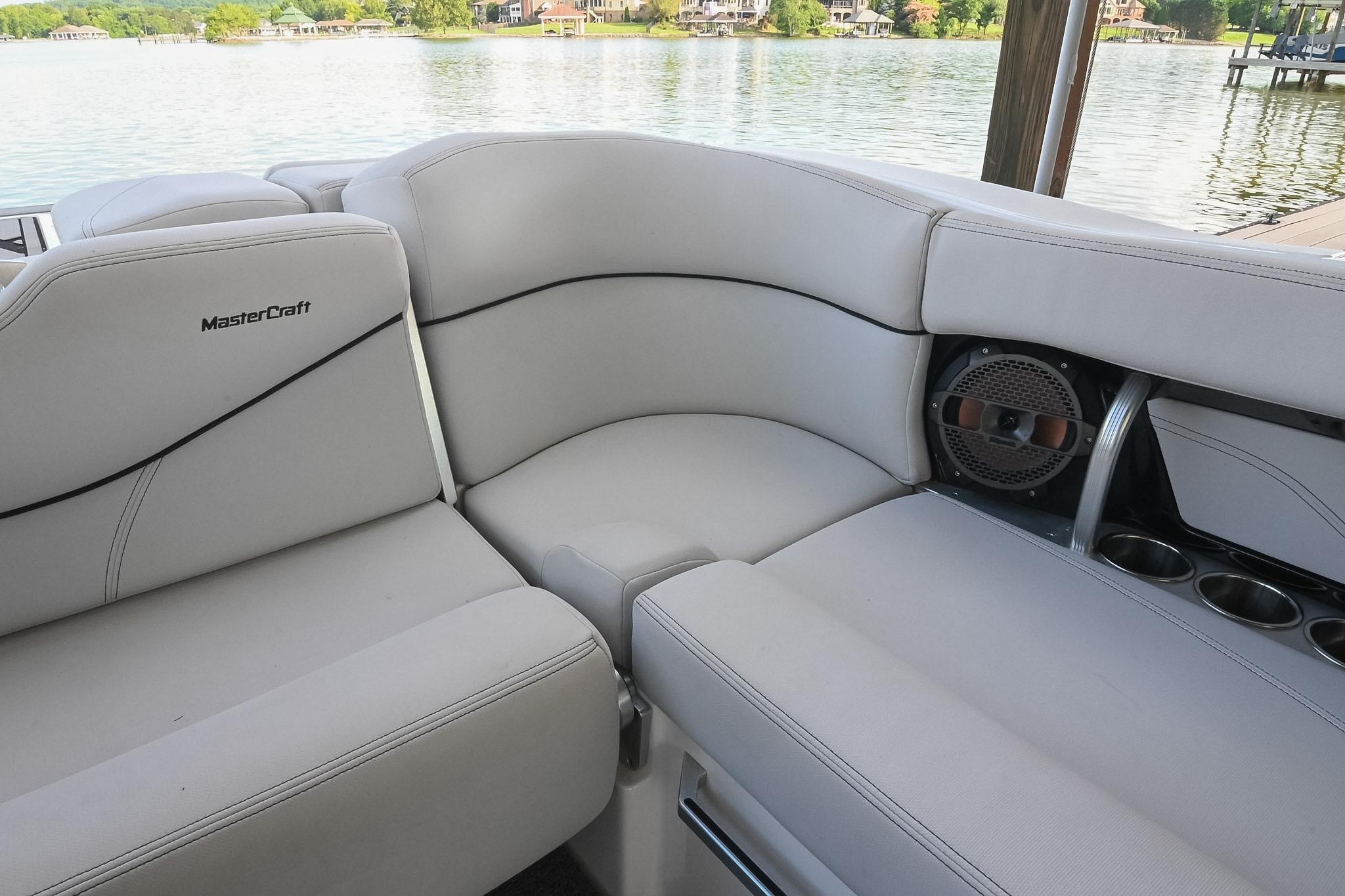 2018 MasterCraft X23 boat interior with plush seating and speaker system.
