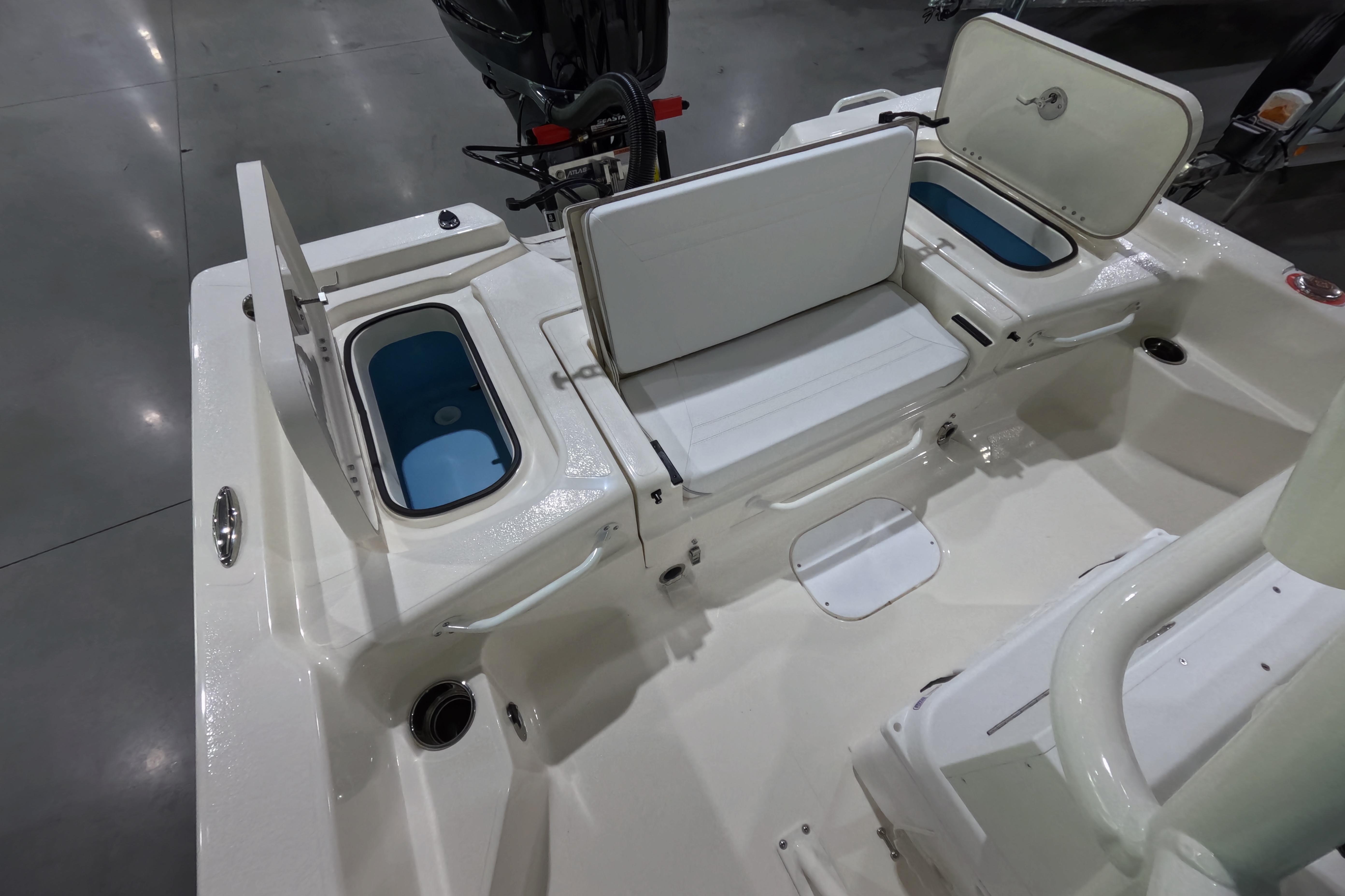 2026 Skeeter SX221 boat interior with open storage compartments and seating.