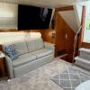 Interior of a 2002 Carver 506 Motor Yacht with a sofa and stairs.