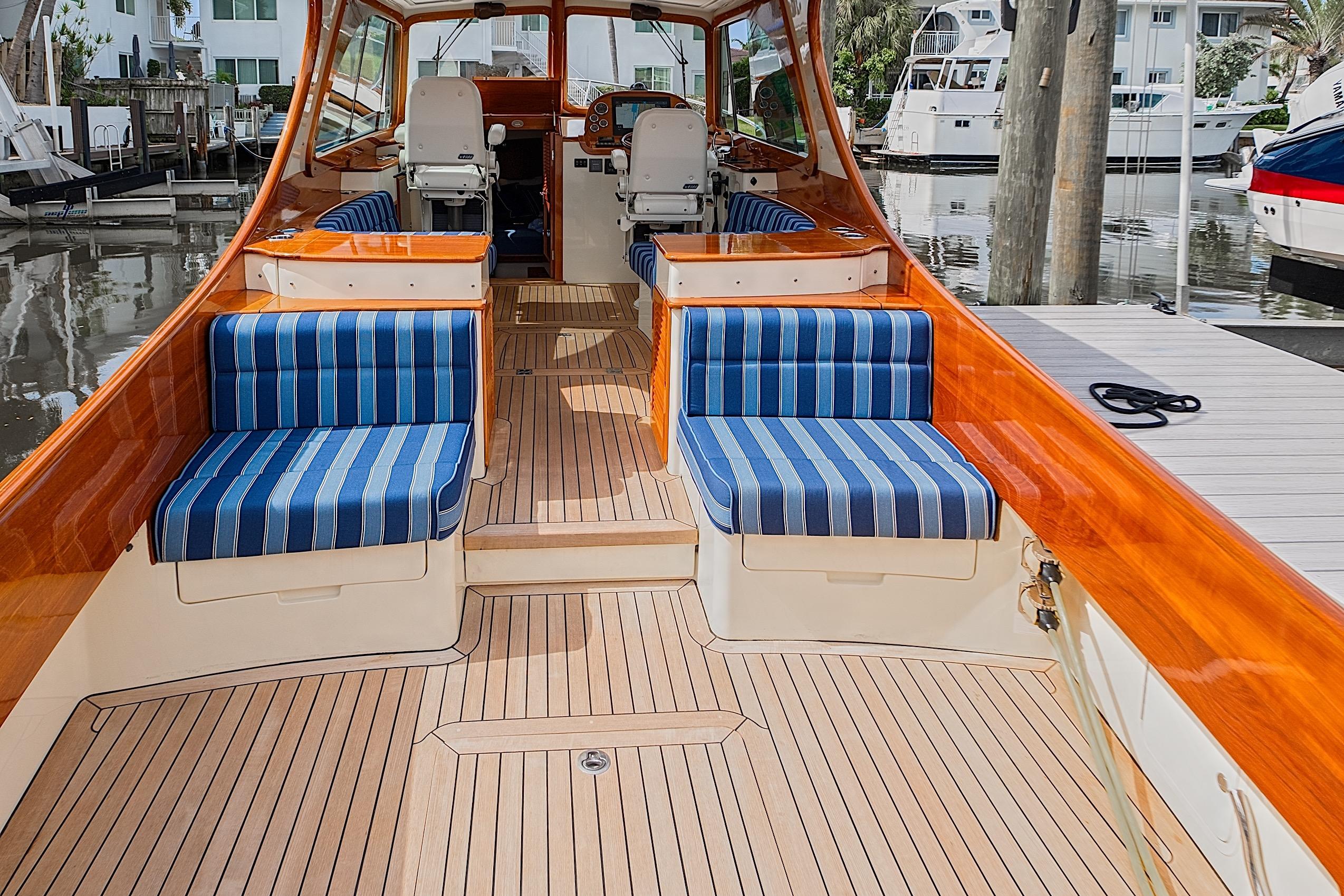 2018 Hinckley Picnic Boat 37 MKIII with striped seating and polished wood interior.
