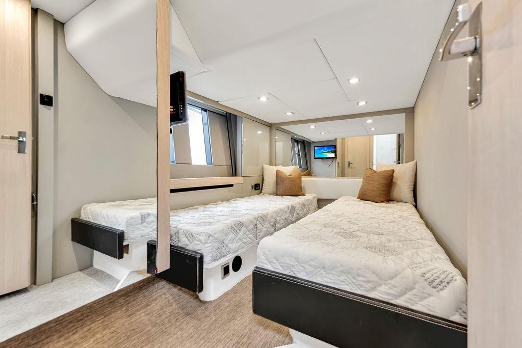 Luxurious twin cabin interior of 2012 Fairline Targa 58 yacht, featuring modern design and comfort.