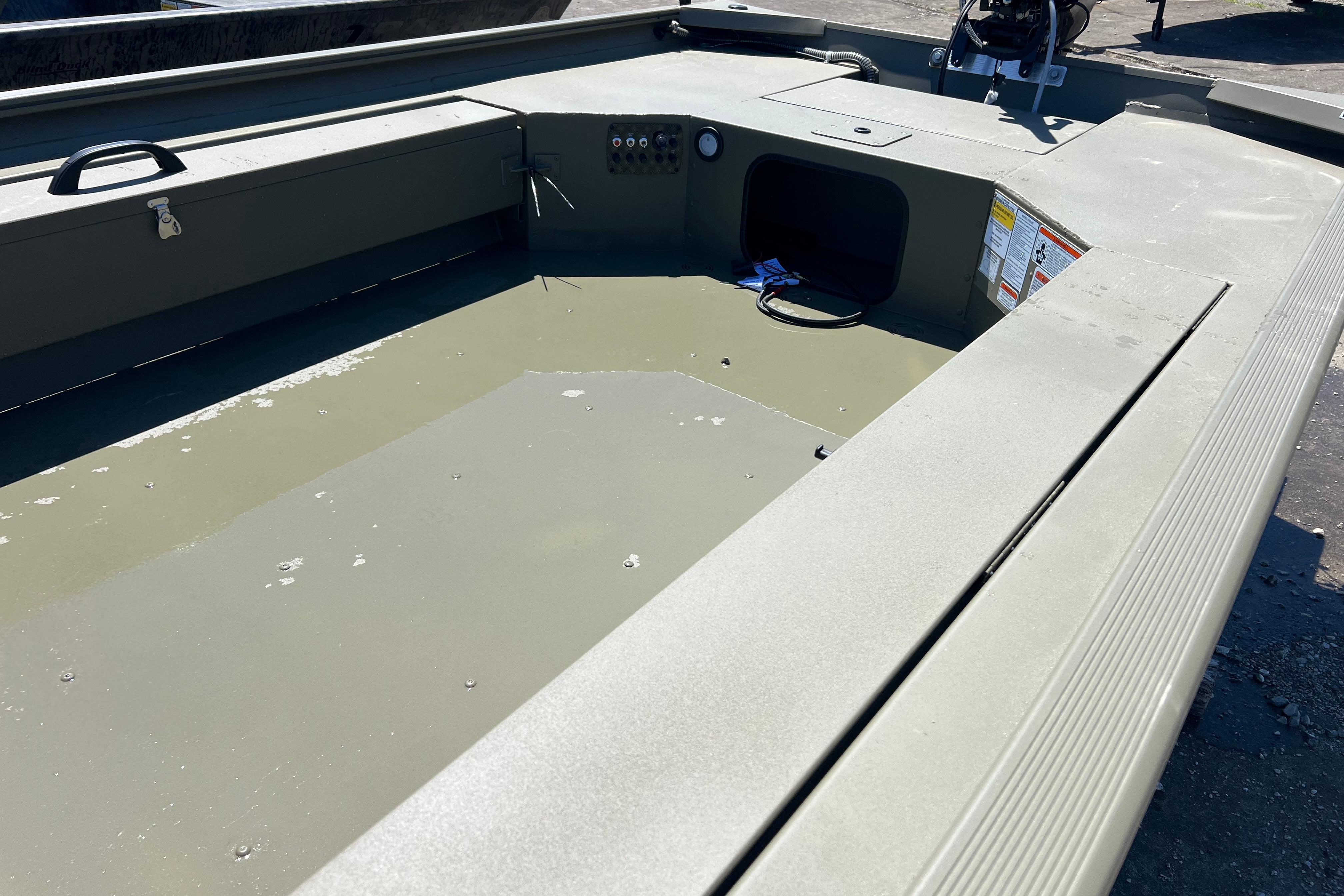2026 Tracker Grizzly 1654 T Sportsman boat interior, featuring a spacious, durable deck.