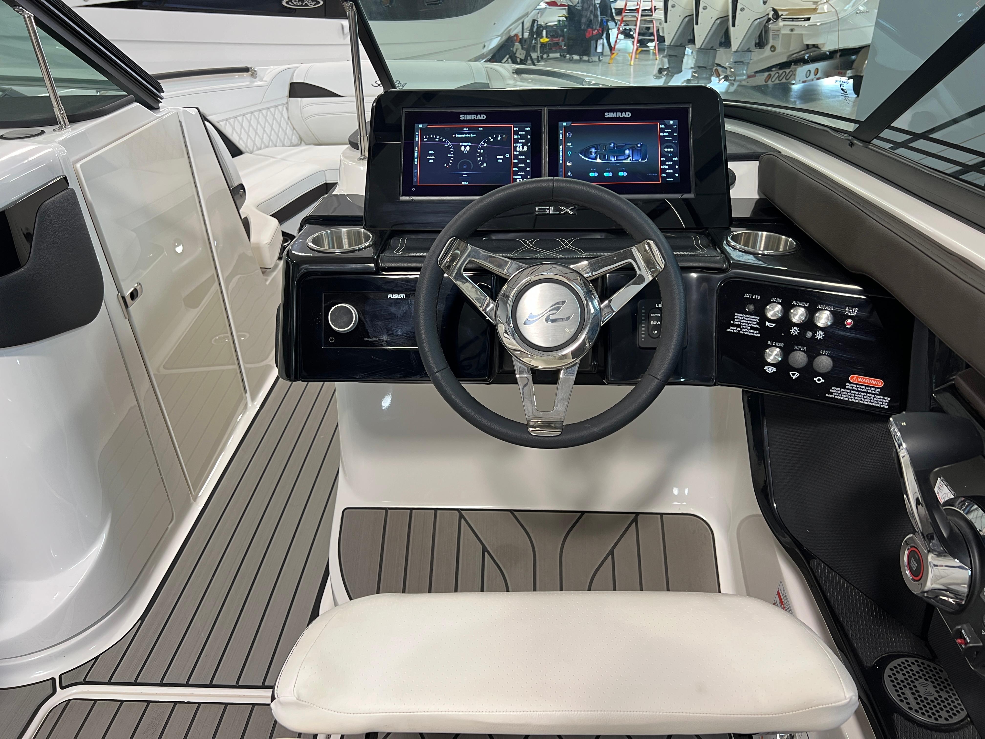 2024 Sea Ray SLX 260 helm with modern controls and sleek design.