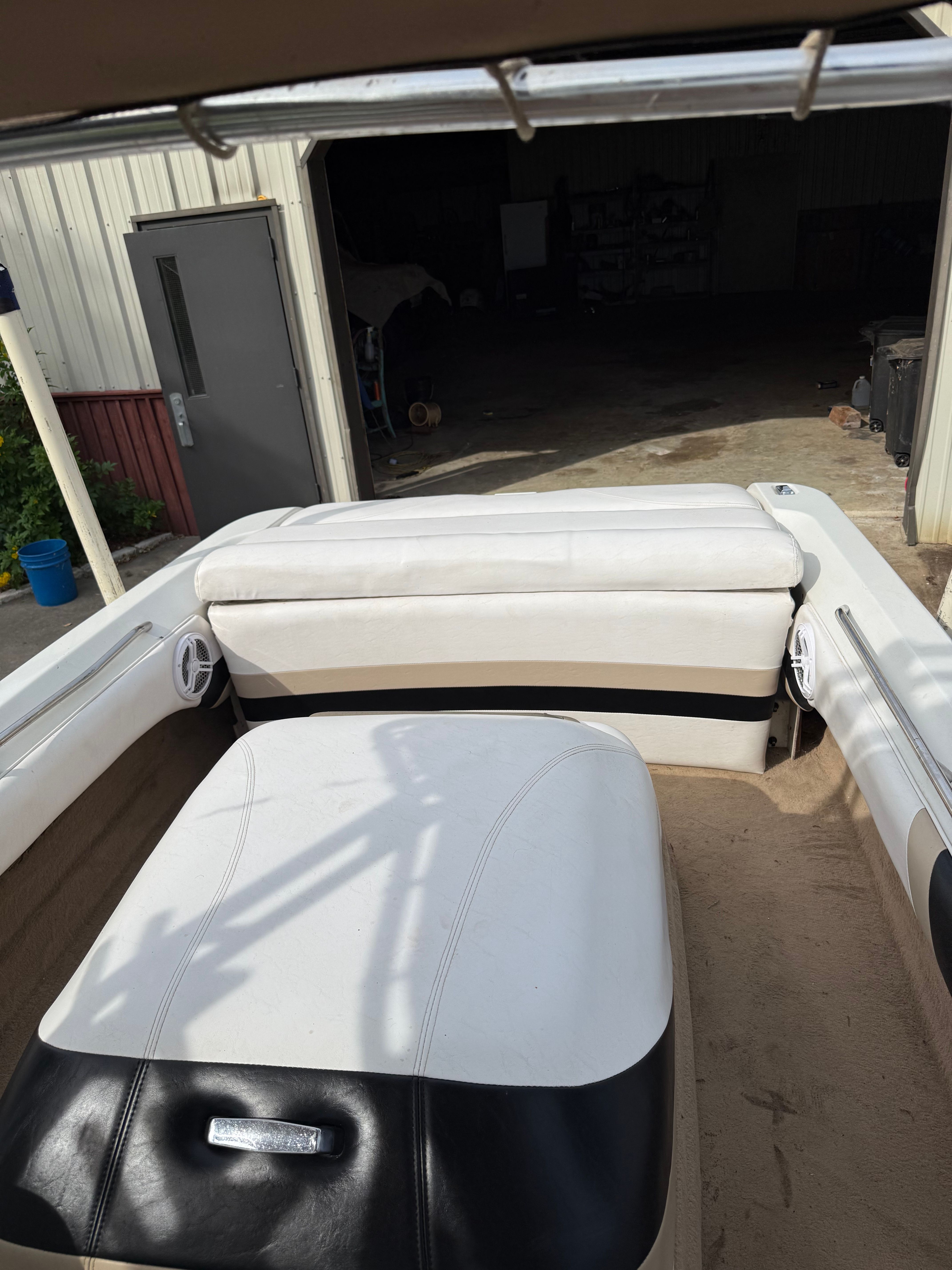 Interior of a 1997 MasterCraft ProStar 190 boat in a garage.