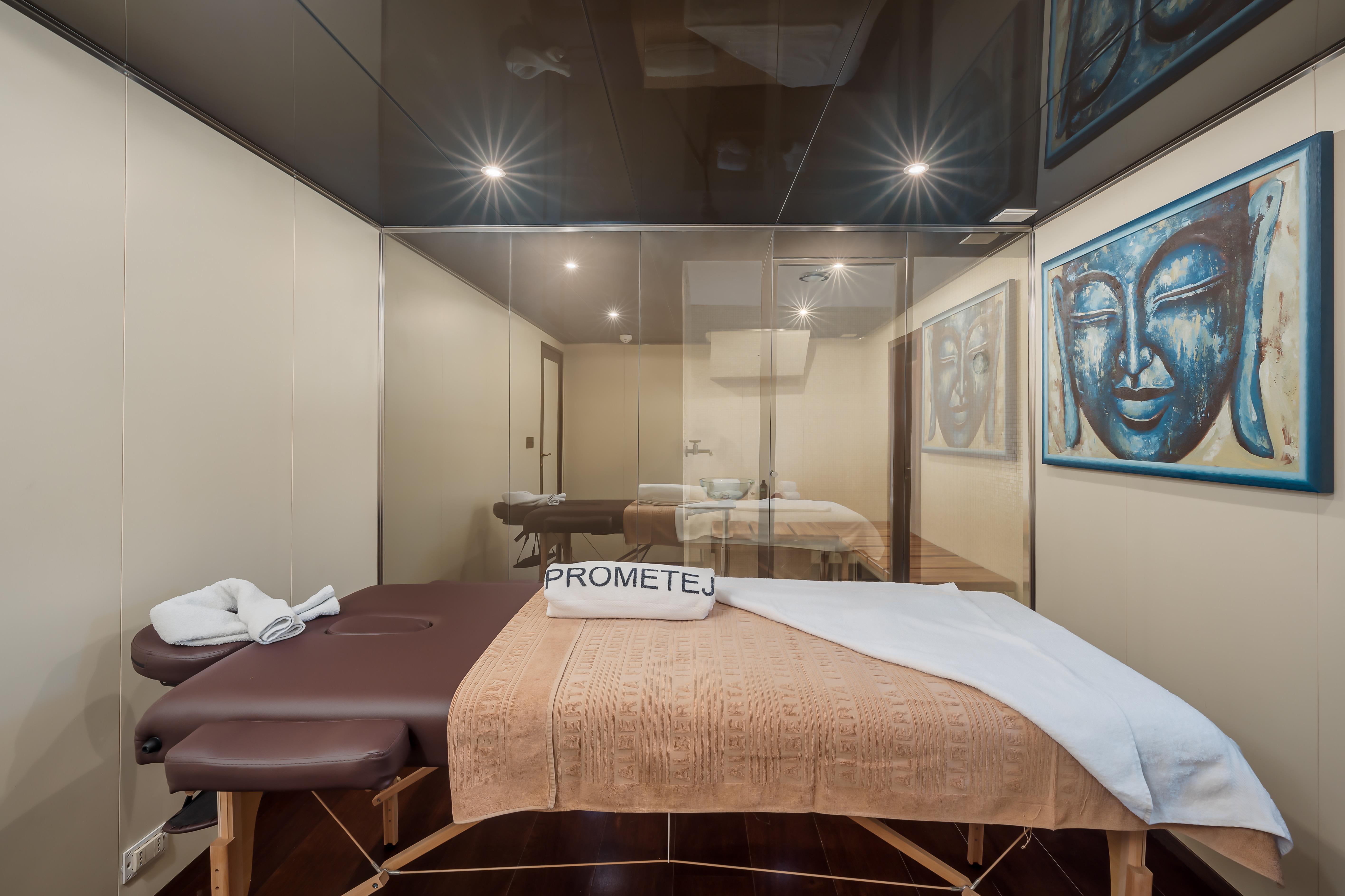 Massage room on a 1956 custom converted tugboat with serene Buddha artwork.