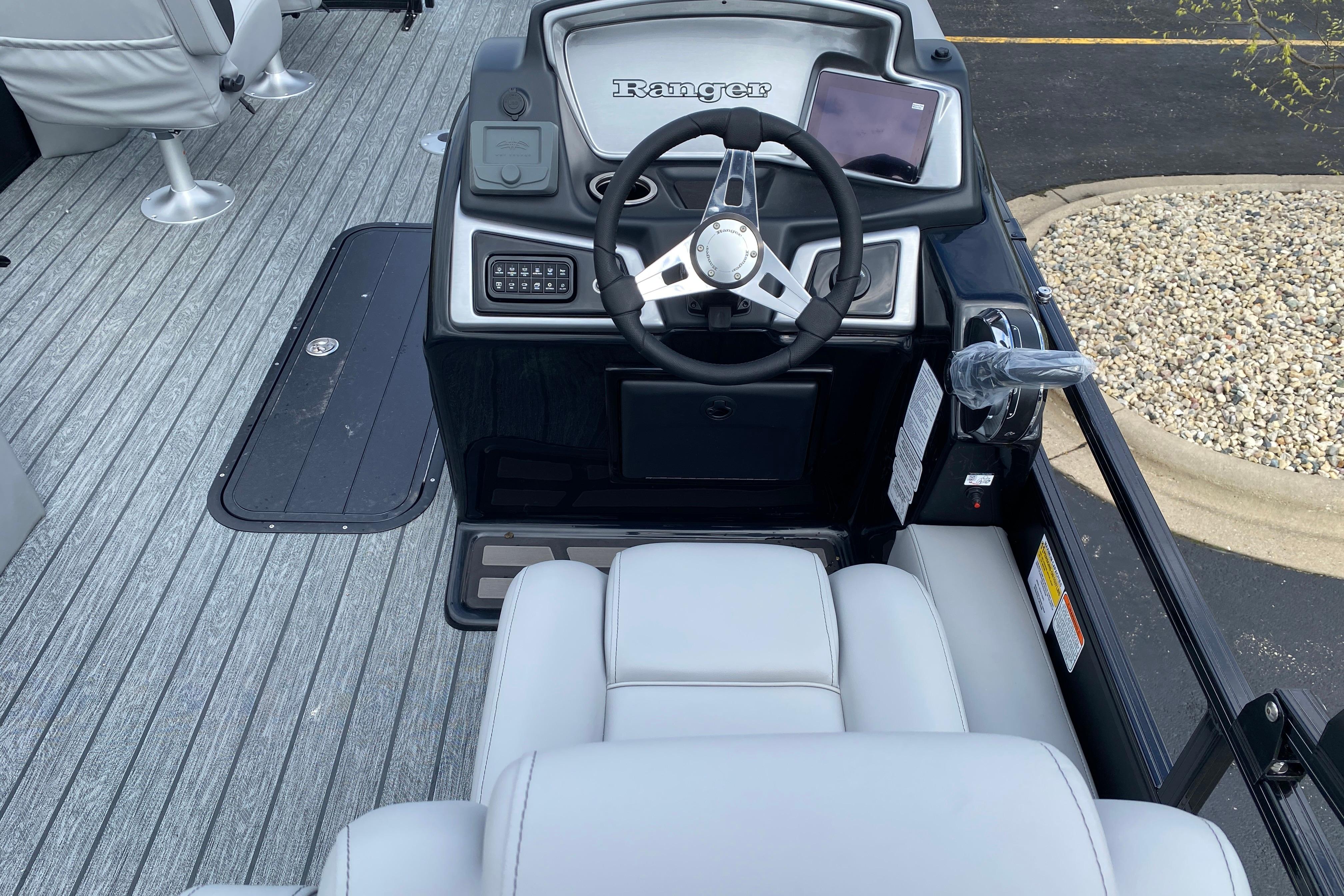 2026 Ranger 223FC boat cockpit with steering wheel and modern controls.