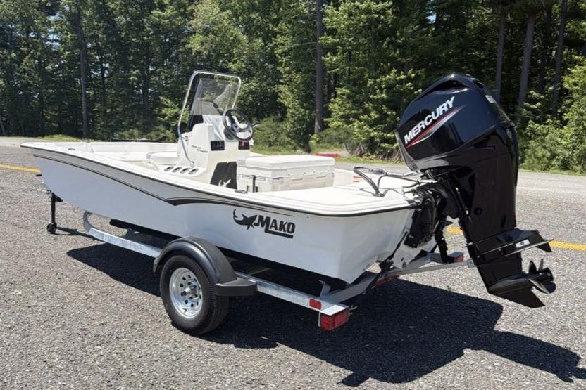 2026 Mako Pro Skiff 15 CC boat with Mercury engine on trailer.