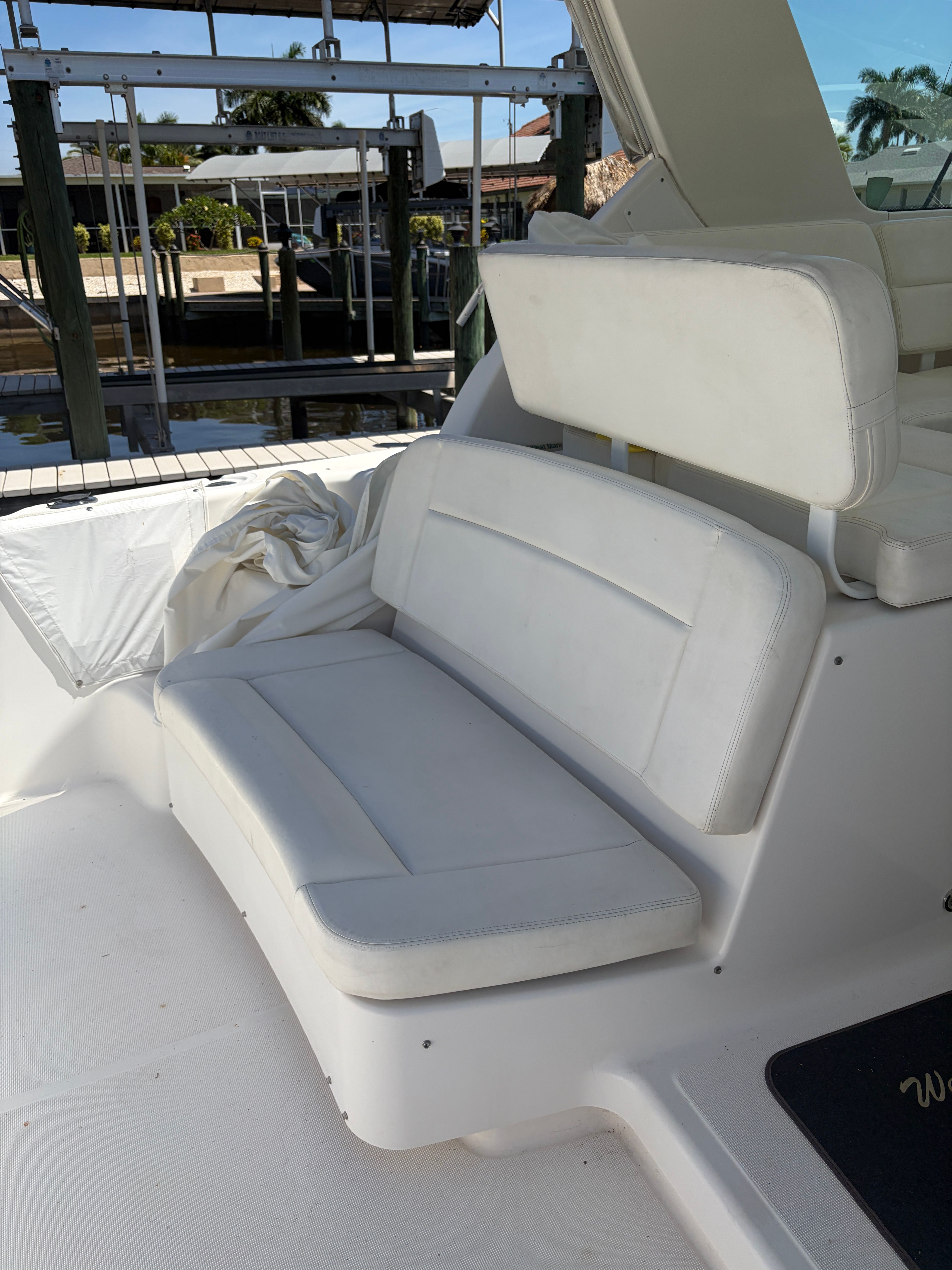 White seating area on a 2005 Tiara Yachts Sovran yacht.