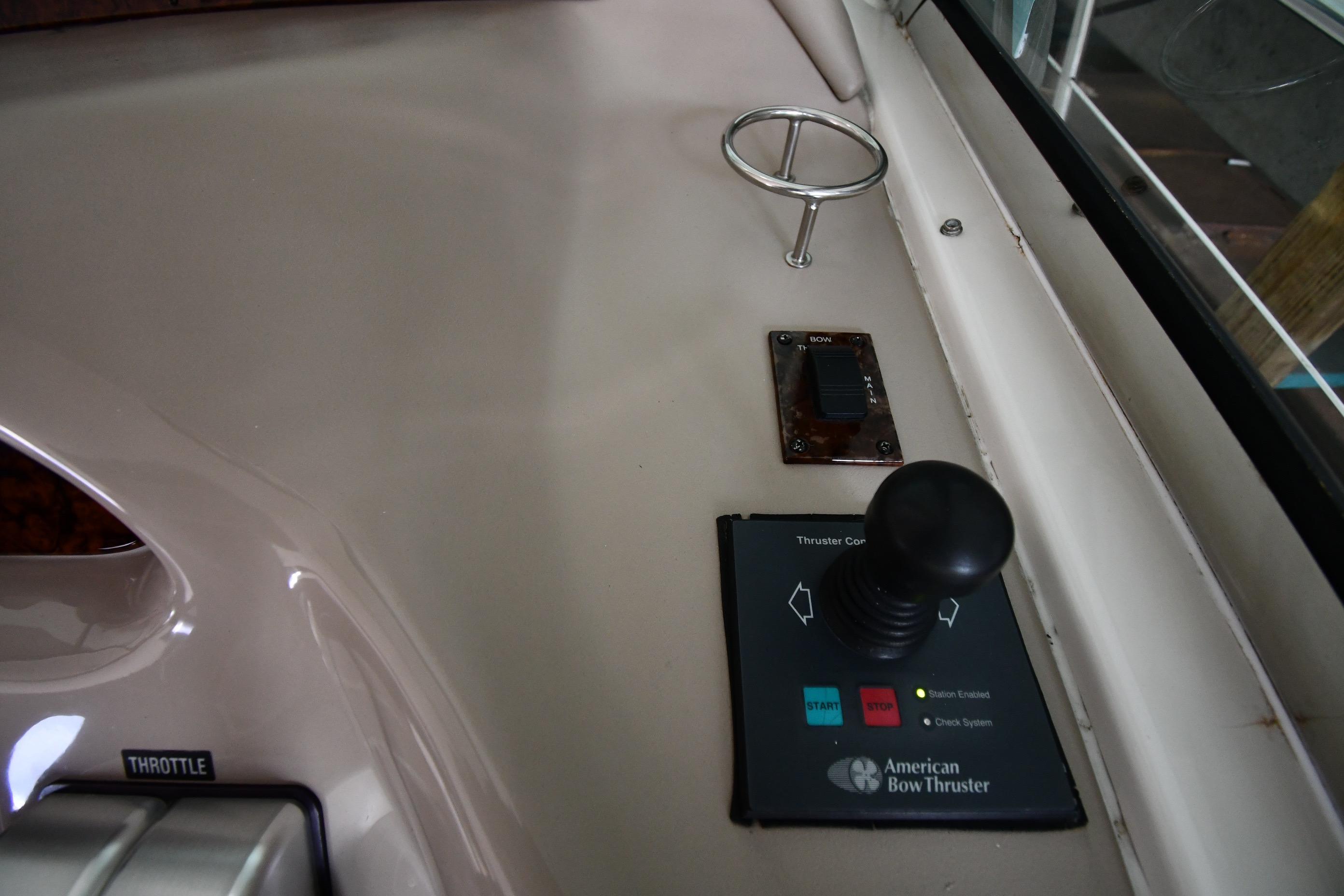 Control panel of a 2001 Sea Ray 540 Sundancer with American Bow Thruster joystick.