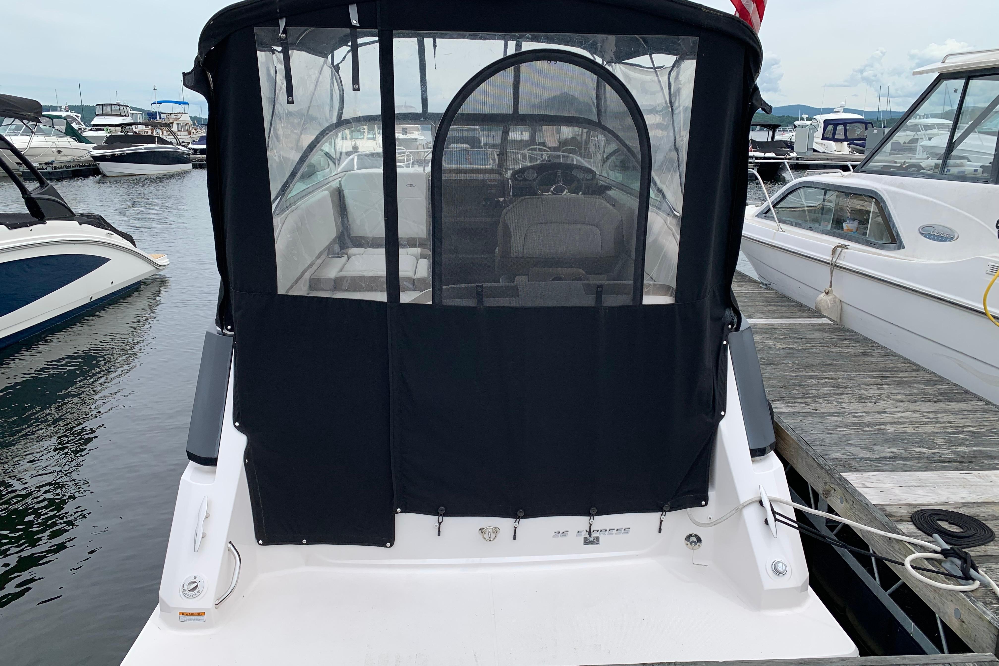 2017 Regal 26 Express boat docked at marina with covered cockpit.