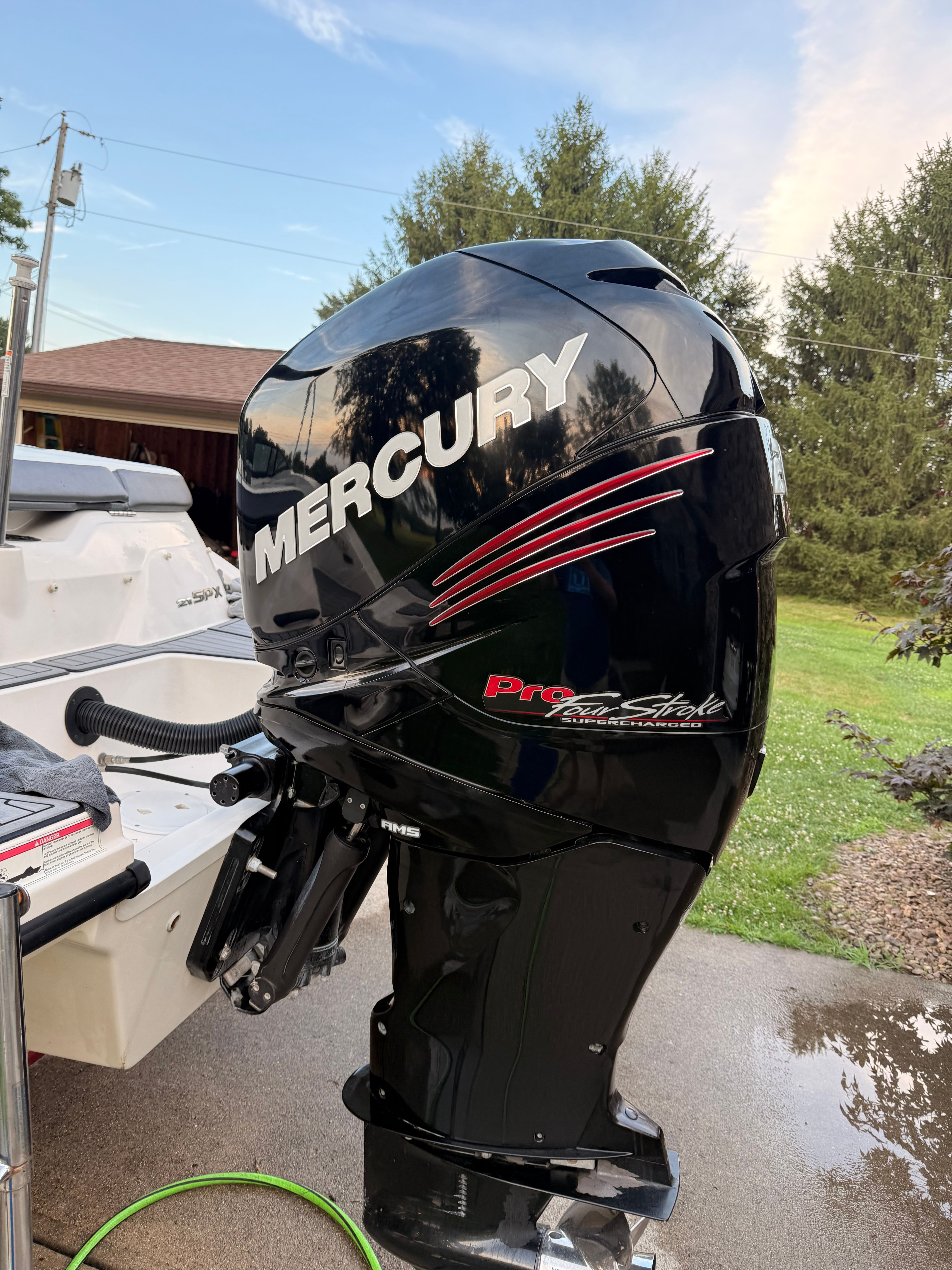 A Mercury Pro XS outboard motor is mounted on a Sea Ray SPX 210 boat.