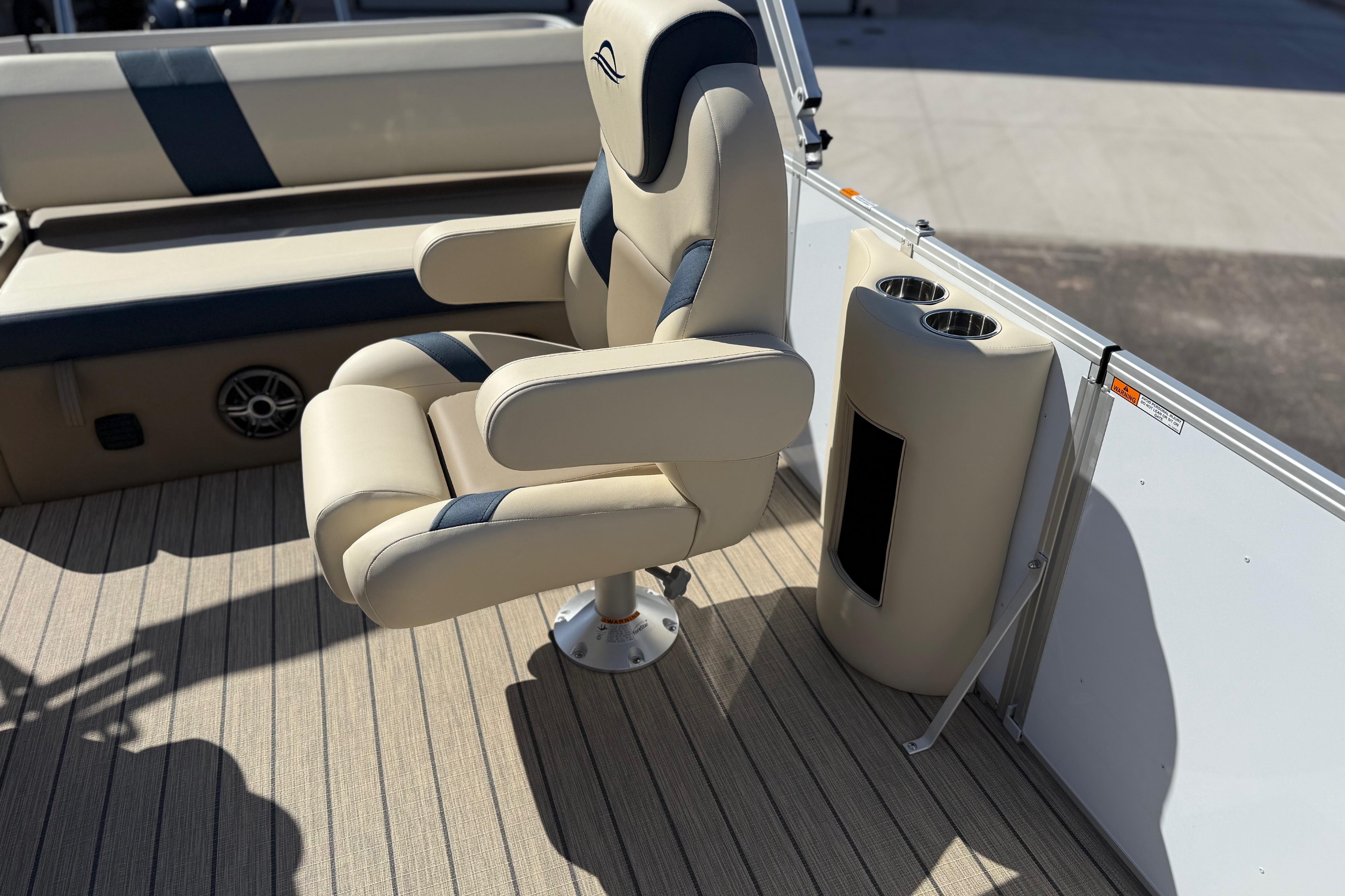 Luxurious seating on 2026 SunCatcher Select 322SL boat with cup holders and stylish design.