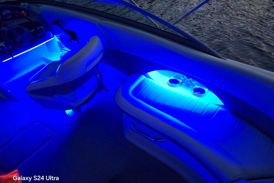 Interior of 2006 Four Winns 244 Funship boat with blue LED lighting.