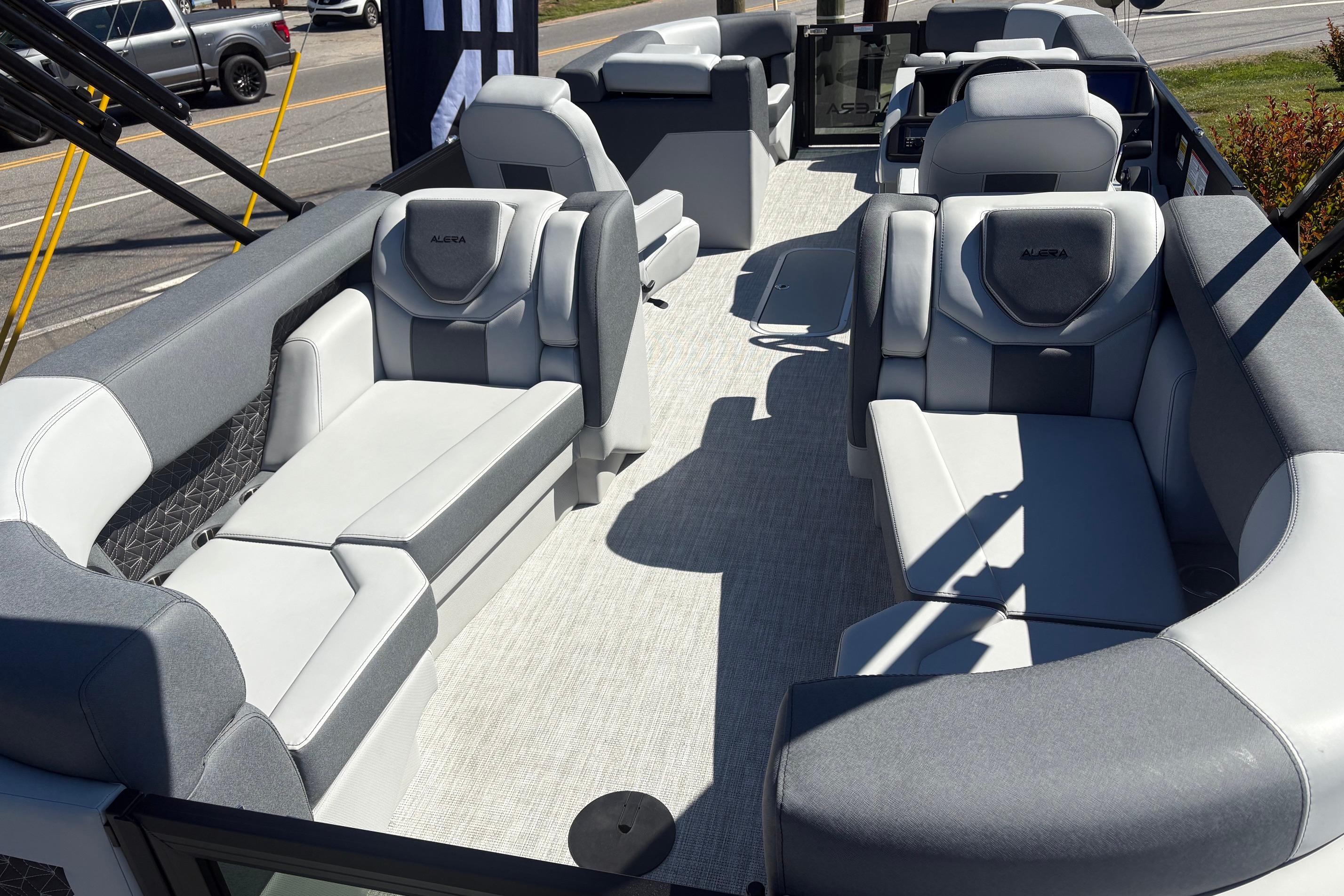 Luxurious 2026 Alera 23Q pontoon boat interior with plush seating and modern design.