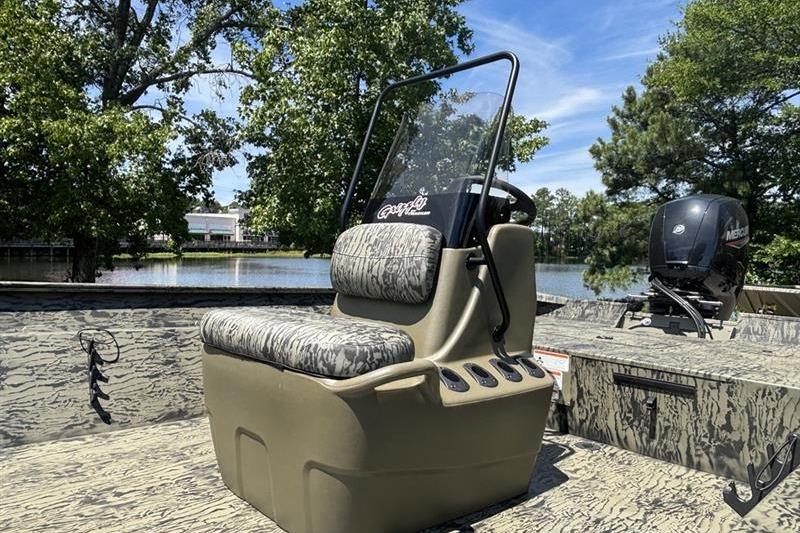 2026 Tracker Grizzly 2072 CC boat with camo seating, console, and Mercury outboard motor.