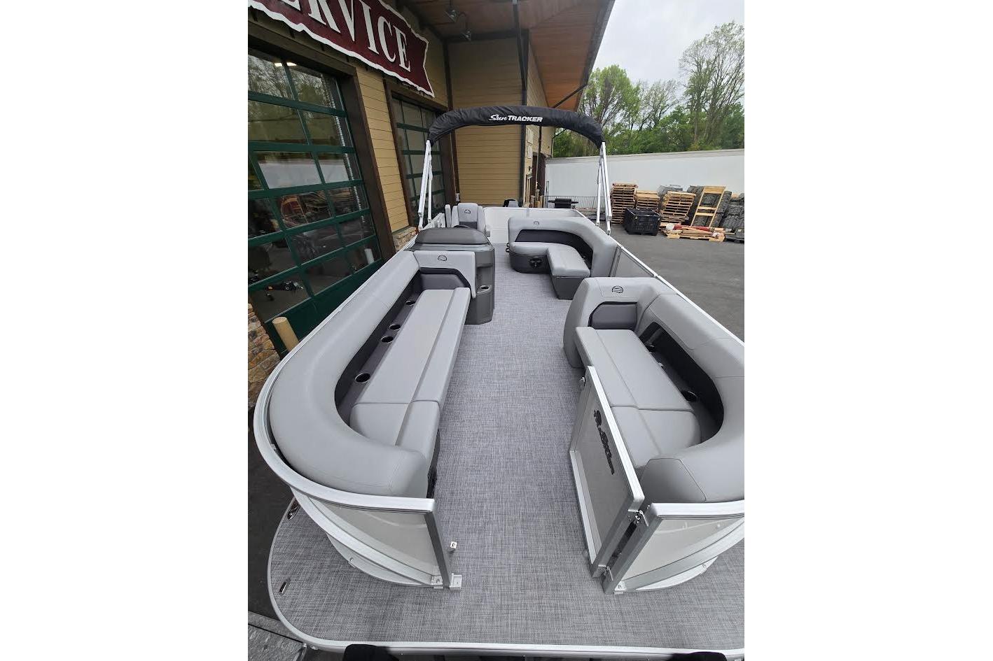 2026 Sun Tracker Party Barge 18 DLX pontoon boat with spacious seating and modern design.