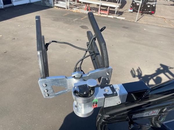 2025 Moomba Mondo boat accessory, featuring a metal and plastic mount on a sunny day.