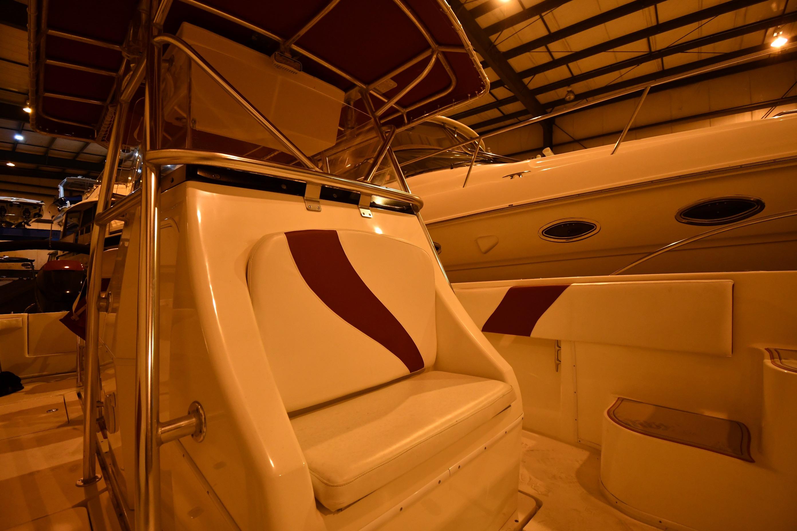 2001 Fountain 38 Center Console boat interior with cushioned seating in a showroom.