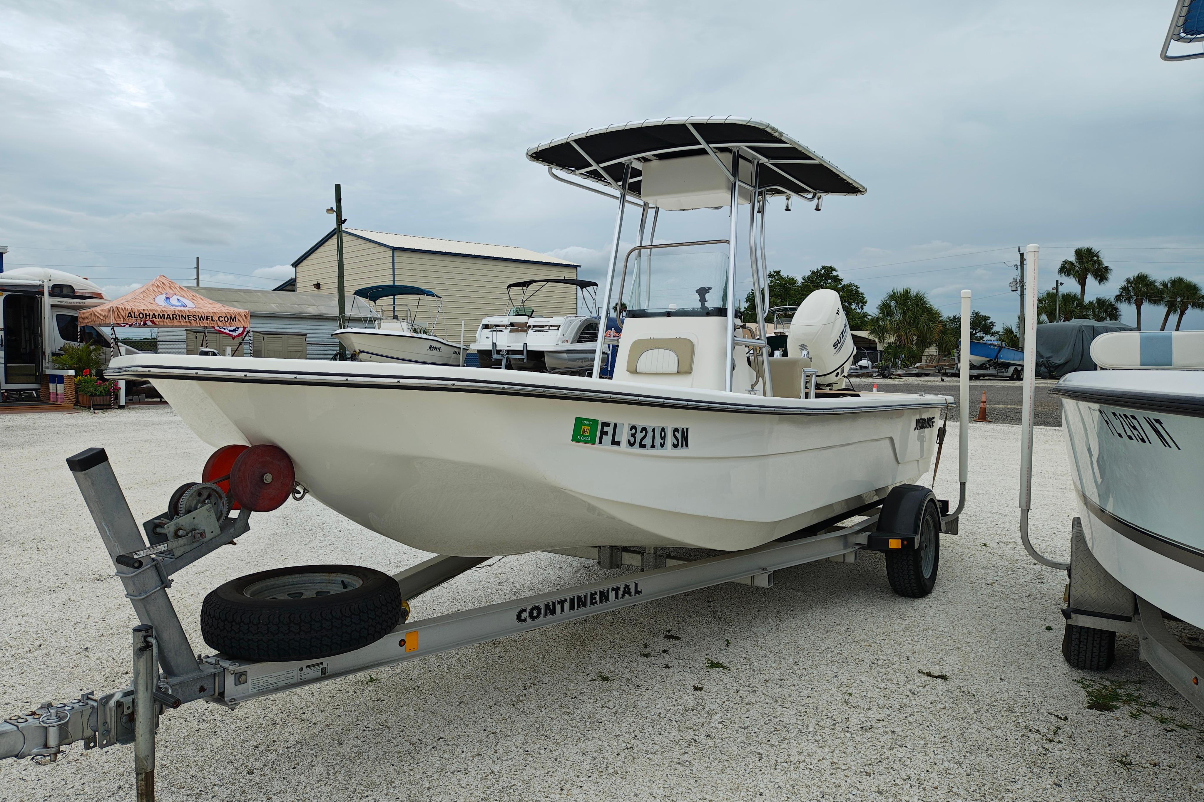 2018 Sundance B20CCR boat on trailer in outdoor lot, overcast sky.